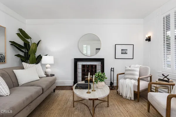 a view of a dining room with furniture wooden floor and chandelier
