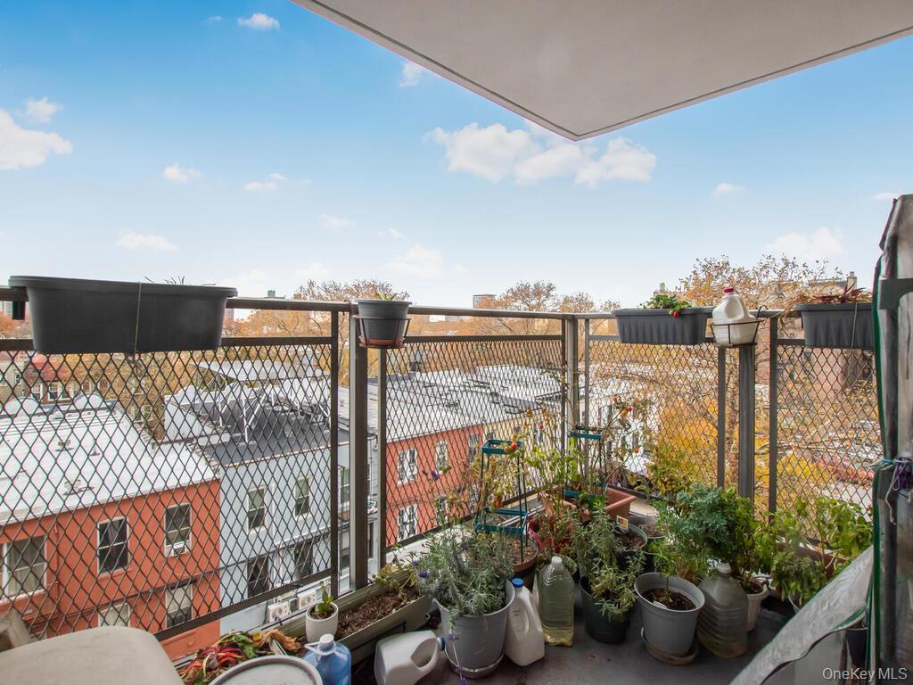 1966 Newbold Avenue, Unit 408 Bronx, NY 10472 - Photo 9 of 10 a terrace with outdoor seating and city view