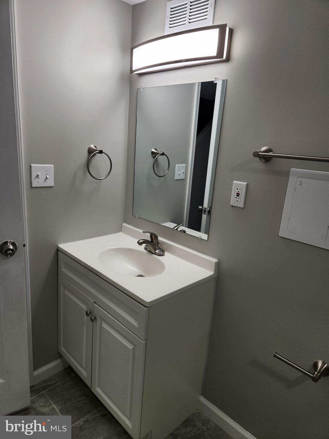 4113 Century Road Baltimore, MD 21206 - Photo 19 of 27 a bathroom with a sink vanity and mirror