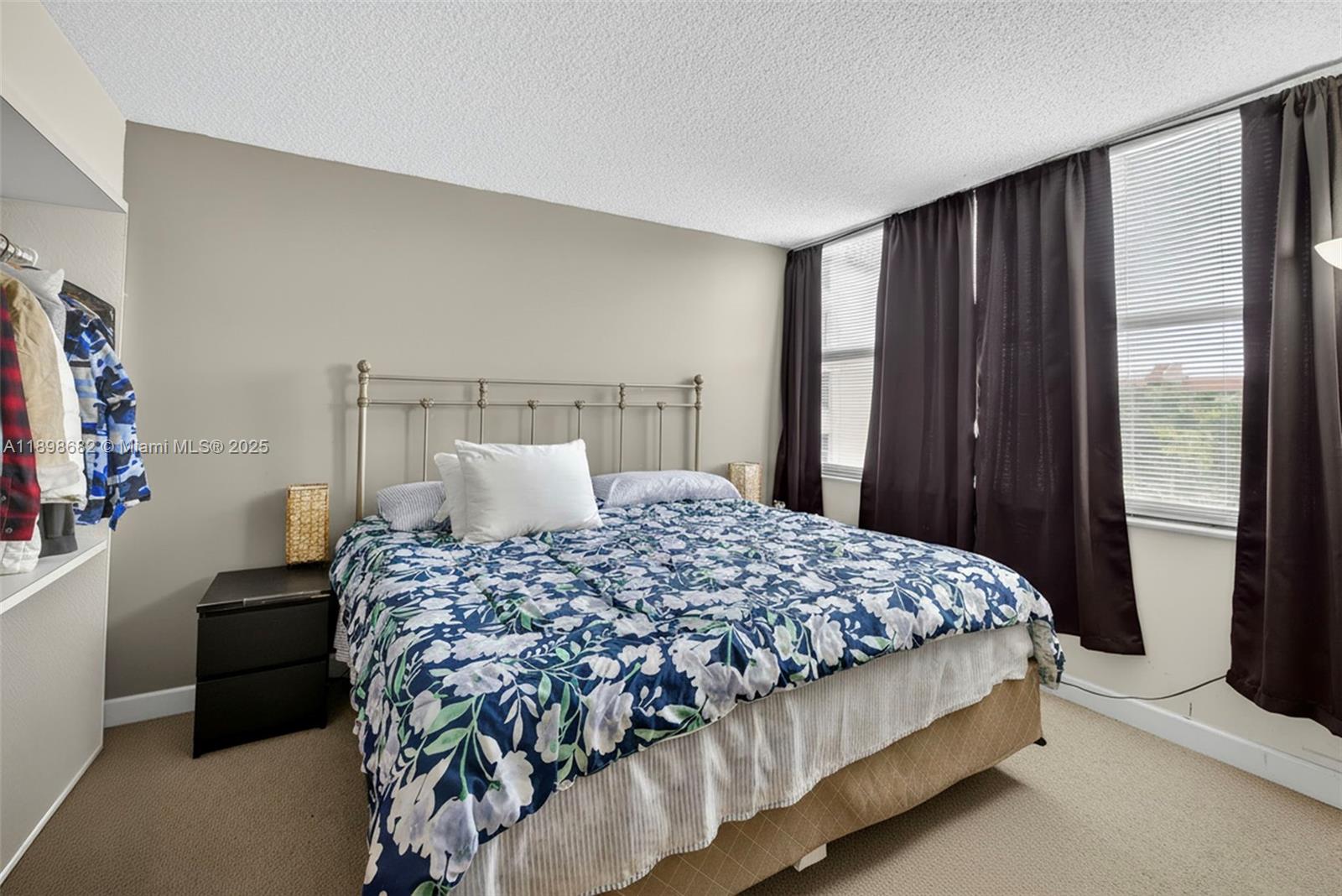 3821 Environ Boulevard, Unit 411 Lauderhill, FL 33319 - Photo 18 of 62 a bedroom with a bed and a window