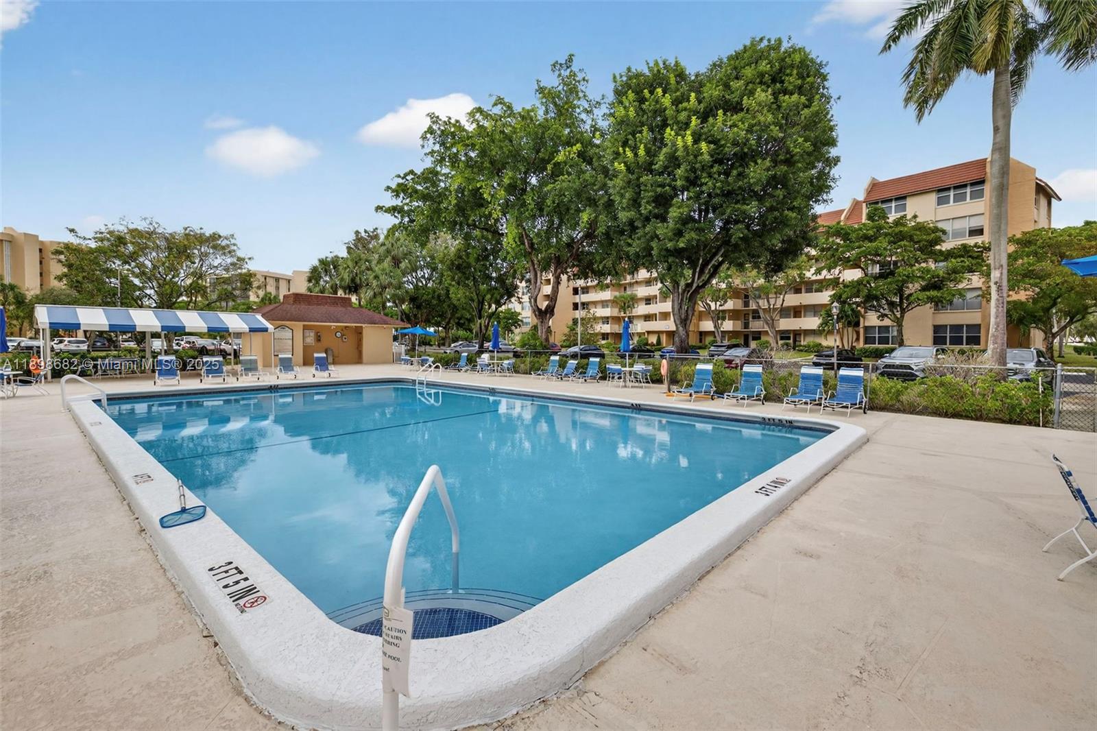 3821 Environ Boulevard, Unit 411 Lauderhill, FL 33319 - Photo 19 of 62 a view of a swimming pool with a terrace