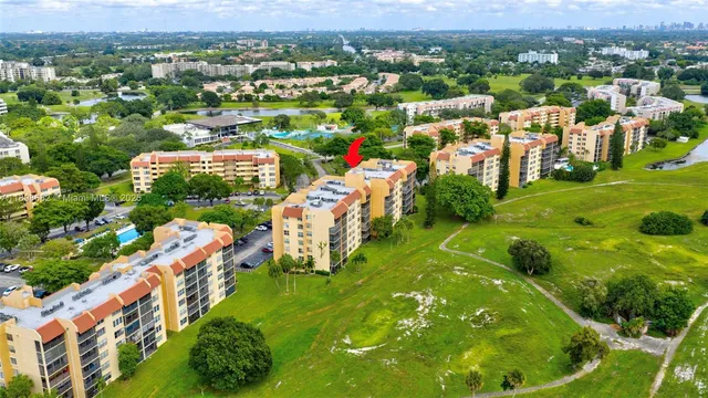 a view of a building with a yard