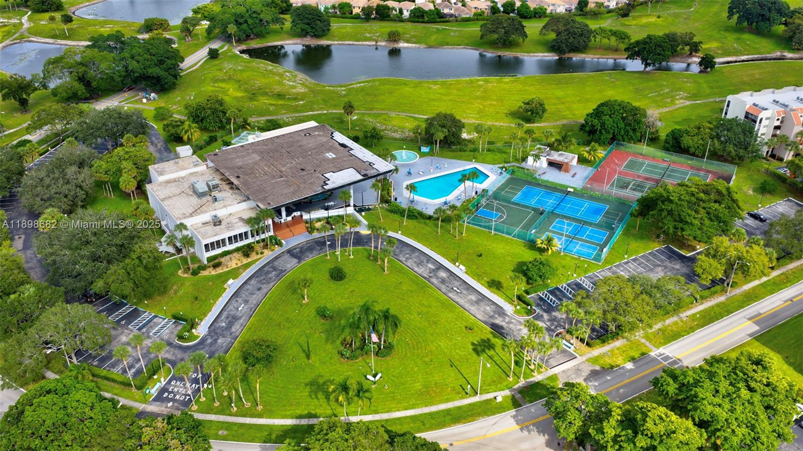 3821 Environ Boulevard, Unit 411 Lauderhill, FL 33319 - Photo 26 of 62 an aerial view of a house with a garden and lake view