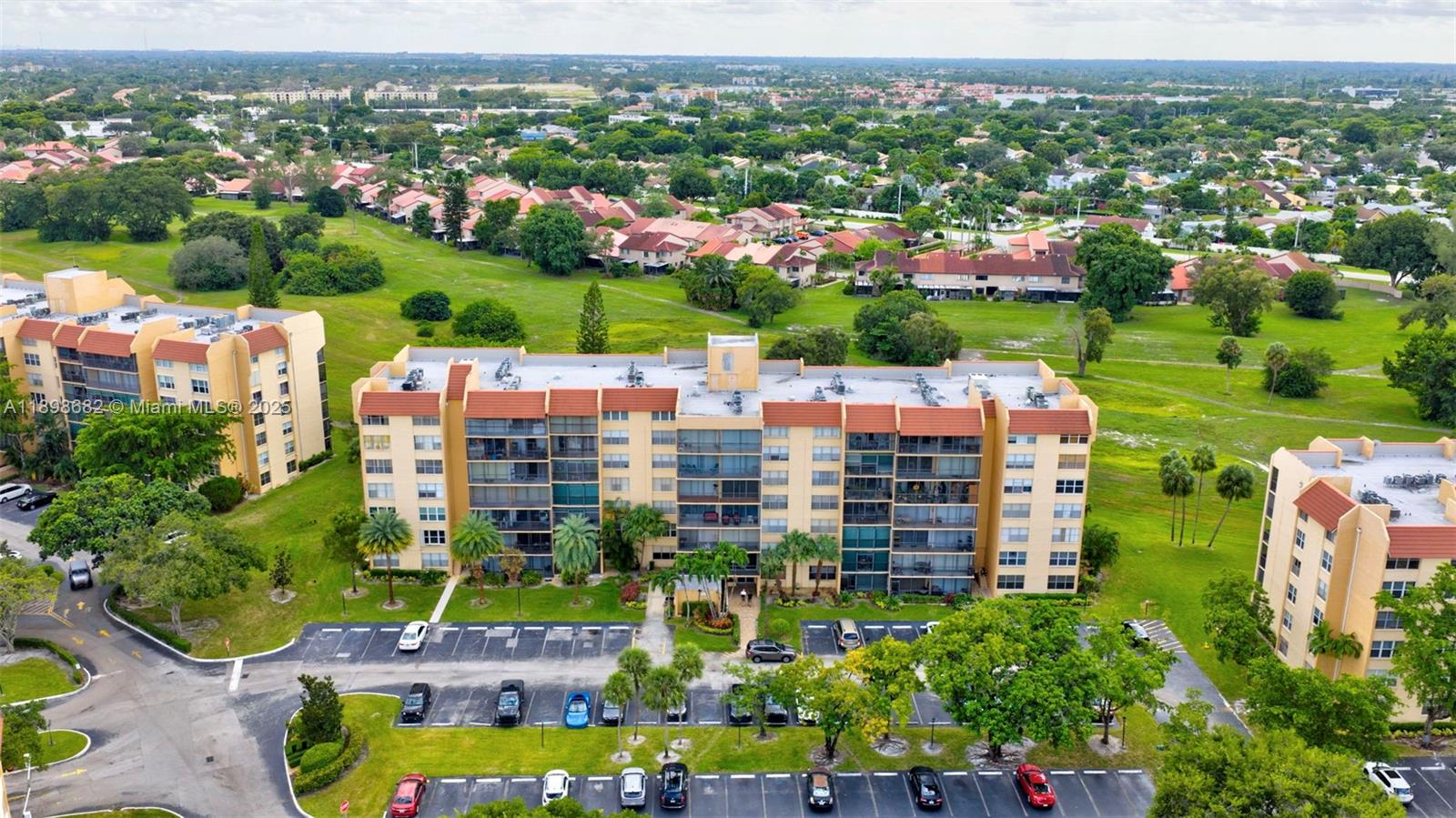 3821 Environ Boulevard, Unit 411 Lauderhill, FL 33319 - Photo 30 of 62 an aerial view of a city with lots of residential buildings ocean and mountain view in back
