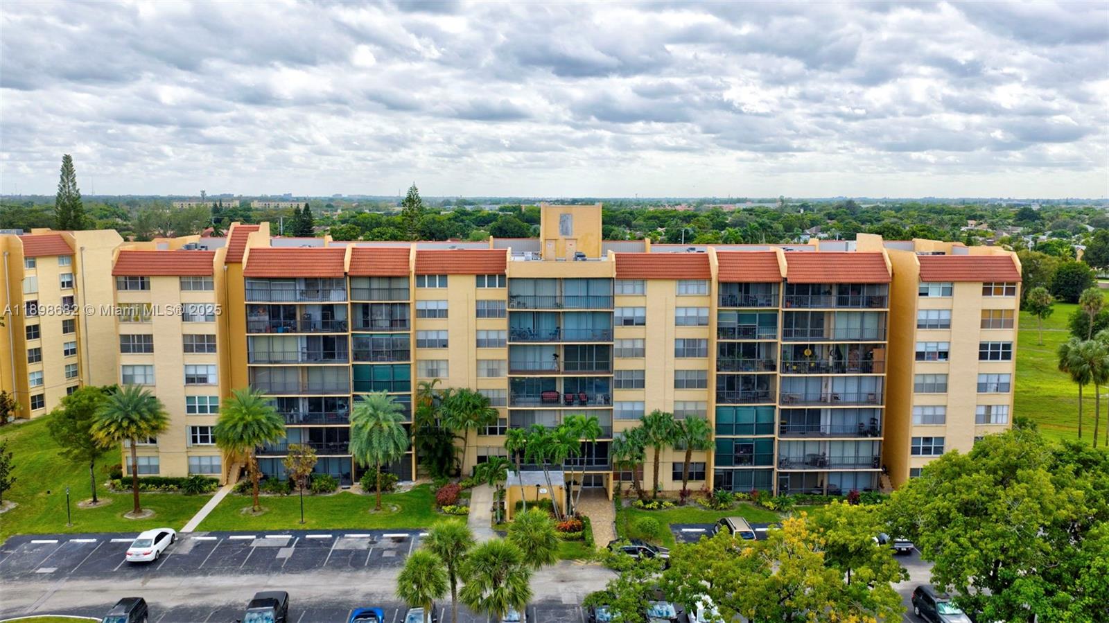 3821 Environ Boulevard, Unit 411 Lauderhill, FL 33319 - Photo 31 of 62 a view of a building with a yard