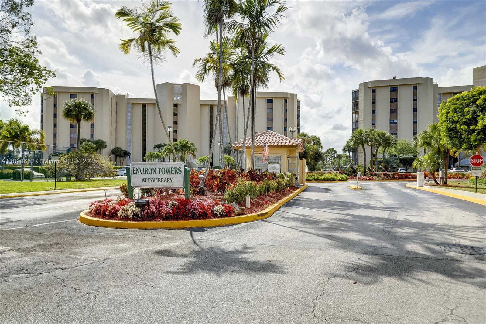 3821 Environ Boulevard, Unit 411 Lauderhill, FL 33319 - Photo 33 of 62 a front view of yellow house with a fountain and a fountain