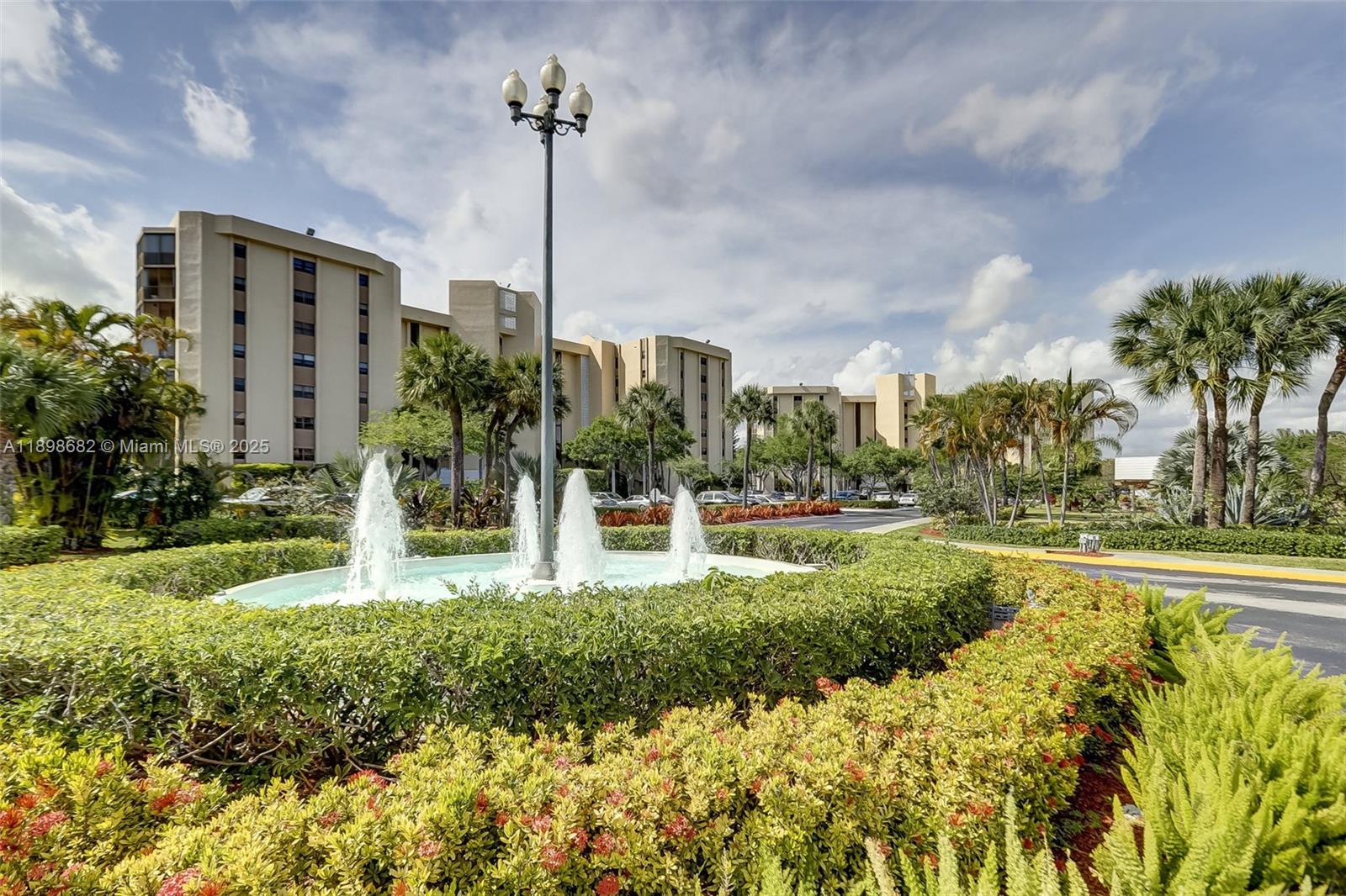 3821 Environ Boulevard, Unit 411 Lauderhill, FL 33319 - Photo 35 of 62 a view of a garden with a fountain