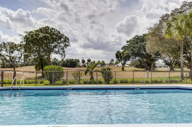 a view of a patio with a table and chairs