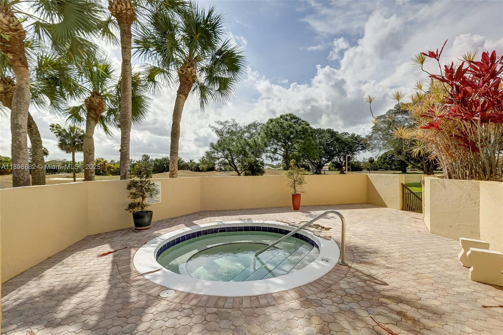 3821 Environ Boulevard, Unit 411 Lauderhill, FL 33319 - Photo 39 of 62 a view of a swimming pool with a patio and lake view