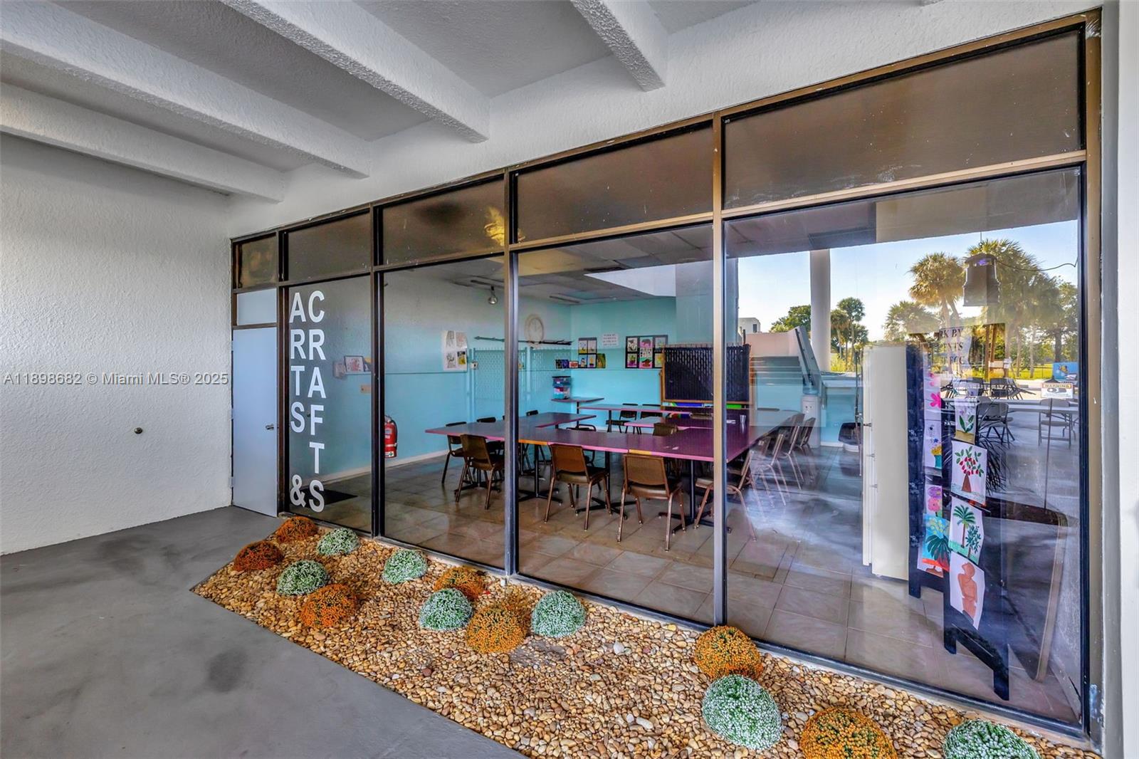 3821 Environ Boulevard, Unit 411 Lauderhill, FL 33319 - Photo 51 of 62 a view of a dining room with furniture window and outside view