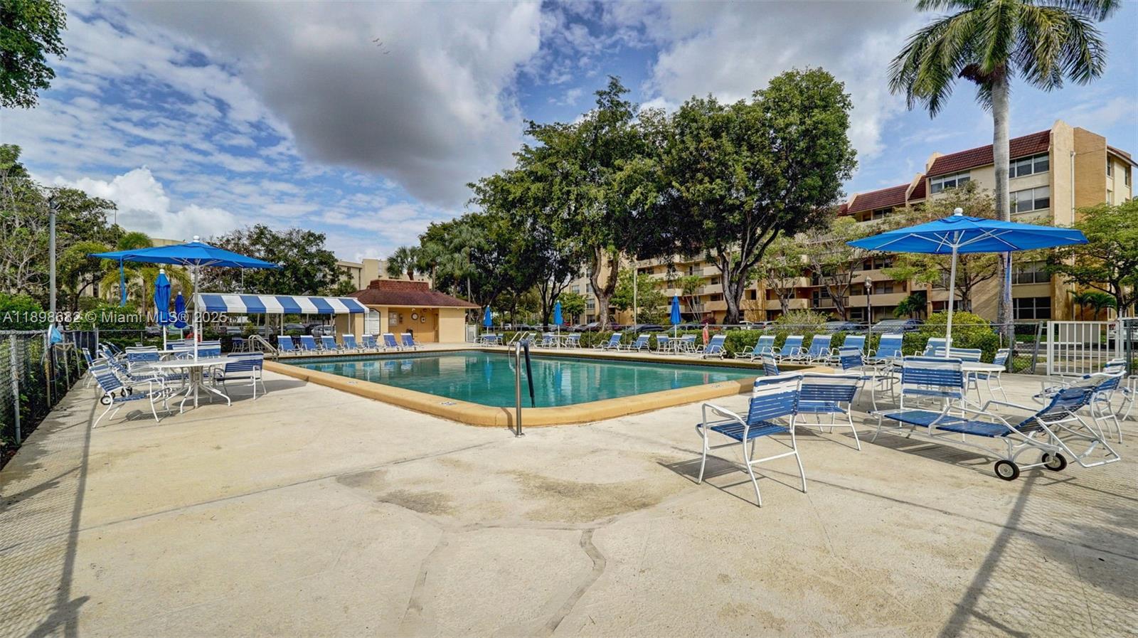 3821 Environ Boulevard, Unit 411 Lauderhill, FL 33319 - Photo 59 of 62 a view of a swimming pool with chairs