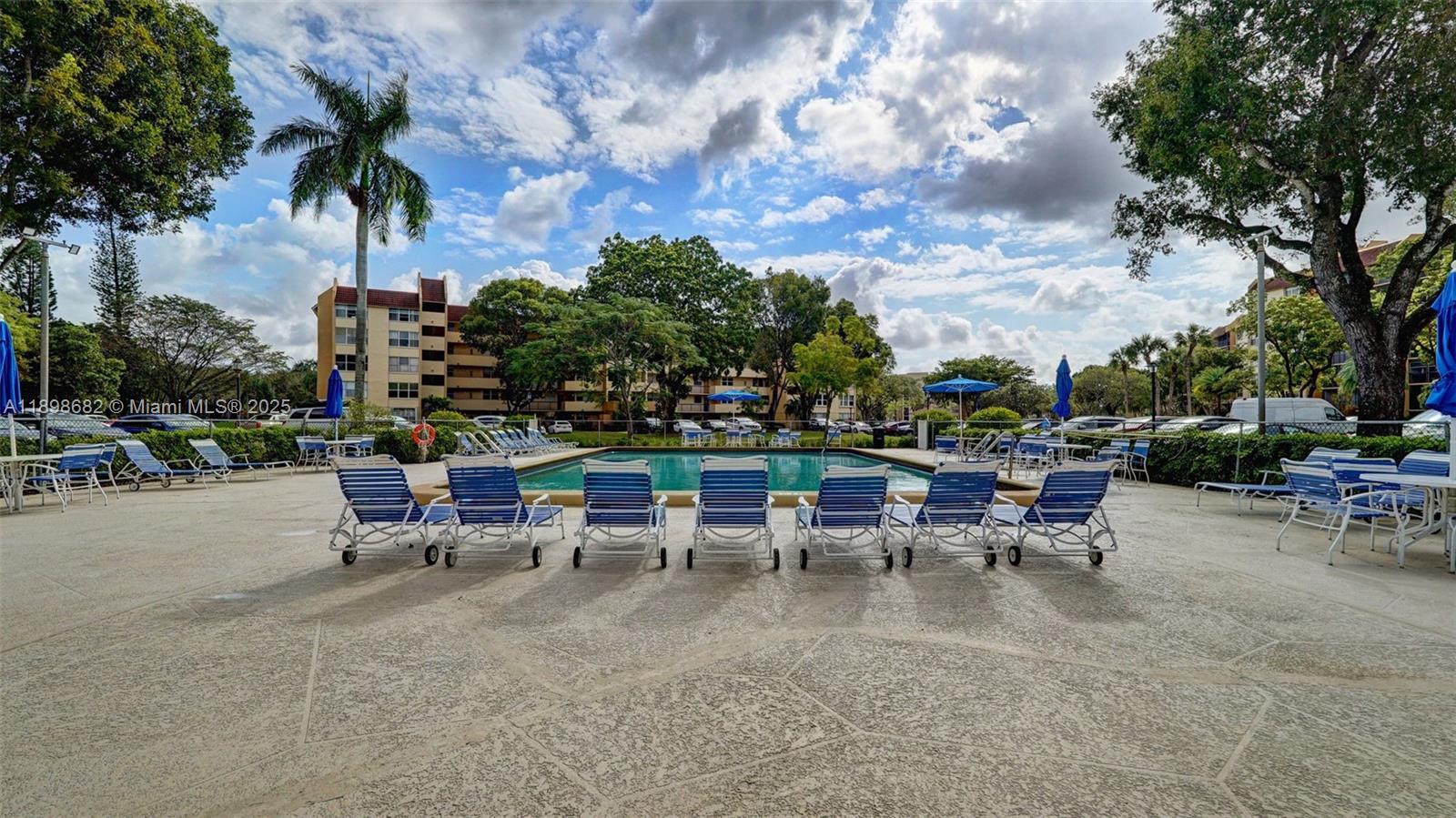 3821 Environ Boulevard, Unit 411 Lauderhill, FL 33319 - Photo 62 of 62 a view of a tables and chairs in a patio