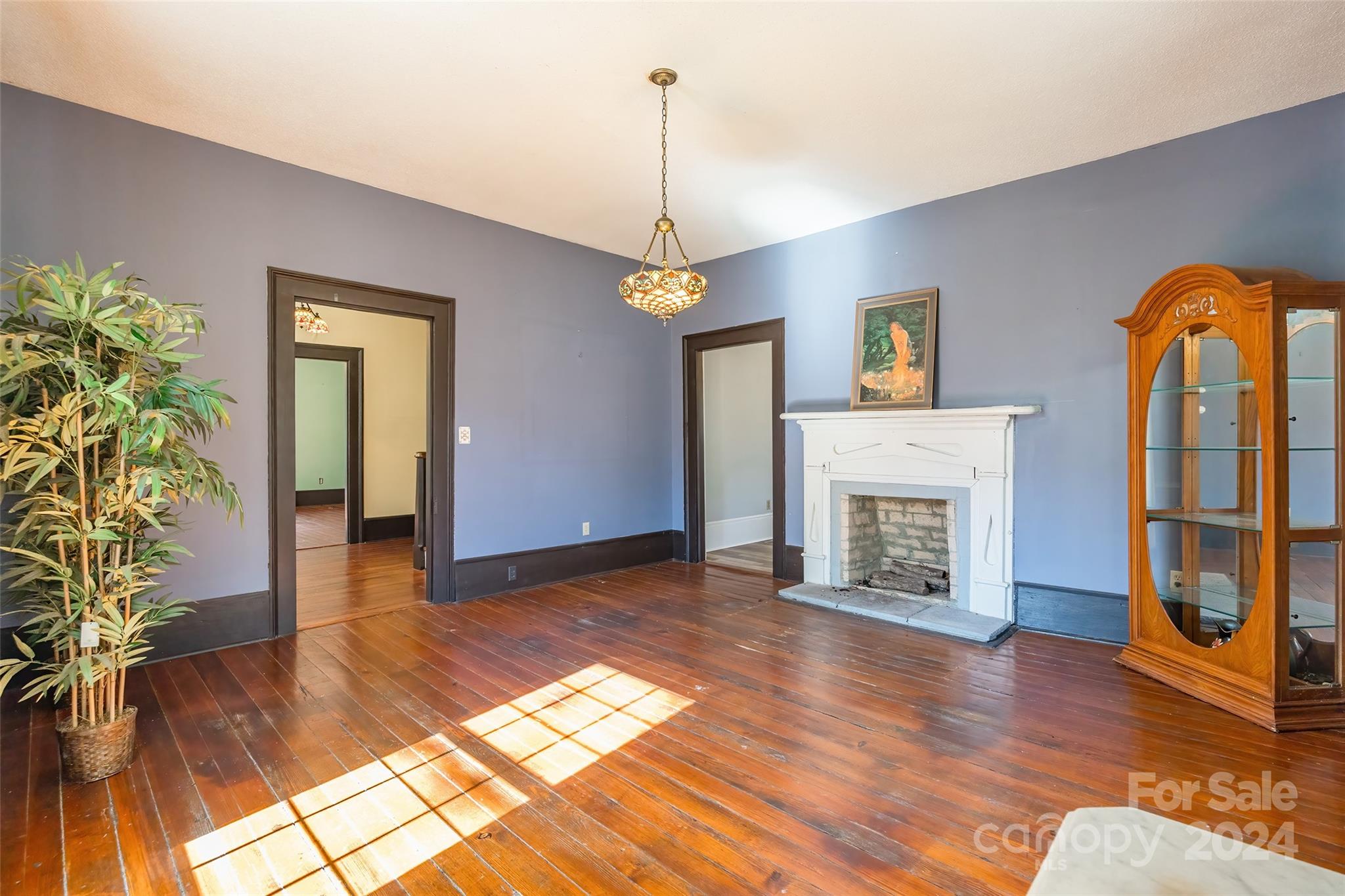 914 Cornwell Road Chester, SC 29706 - Photo 8 of 37 a view of empty room with wooden floor and fireplace