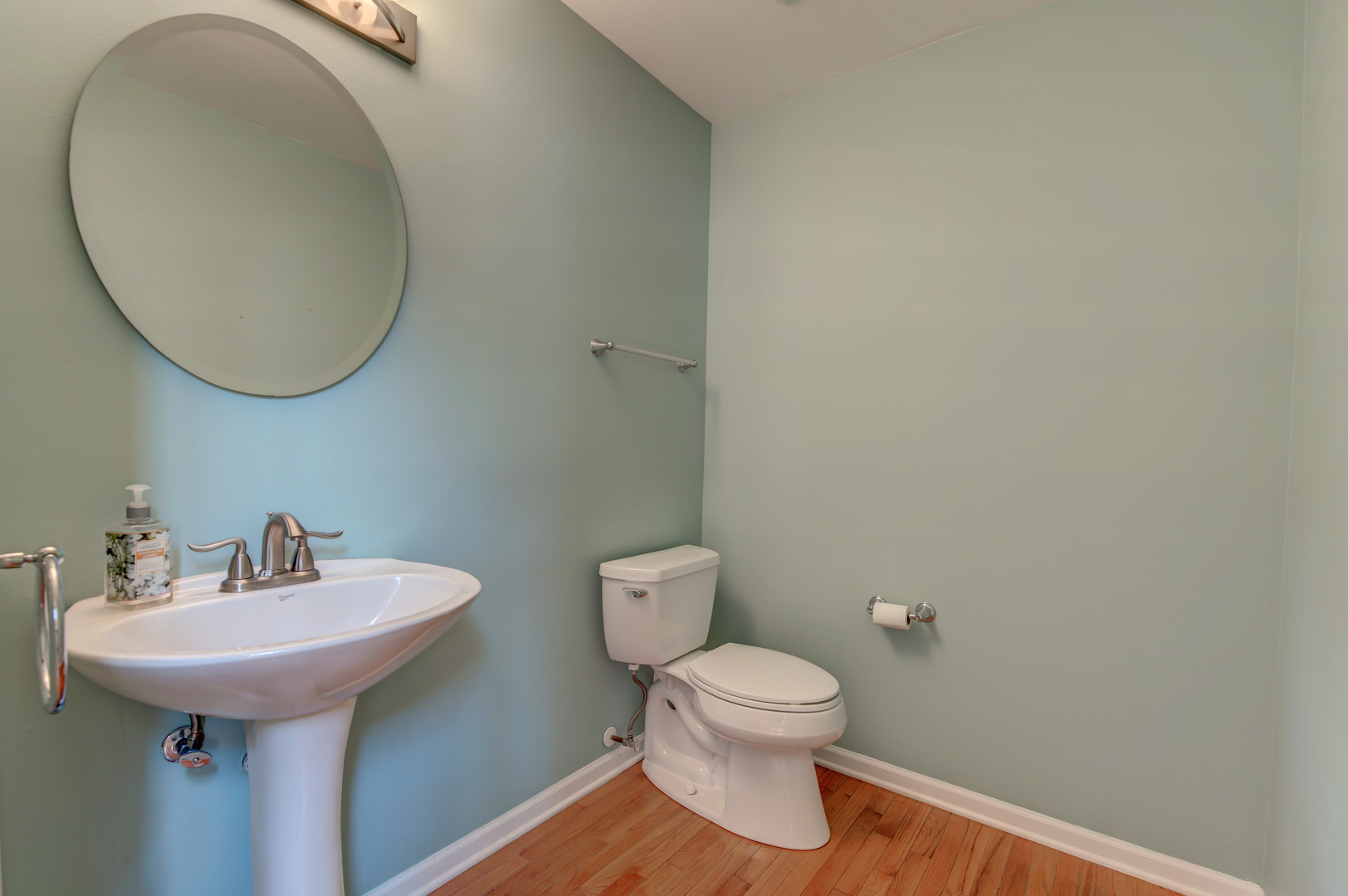 860 Spring Creek Circle Naperville, IL 60565 - Photo 16 of 26 a bathroom with a toilet sink and mirror