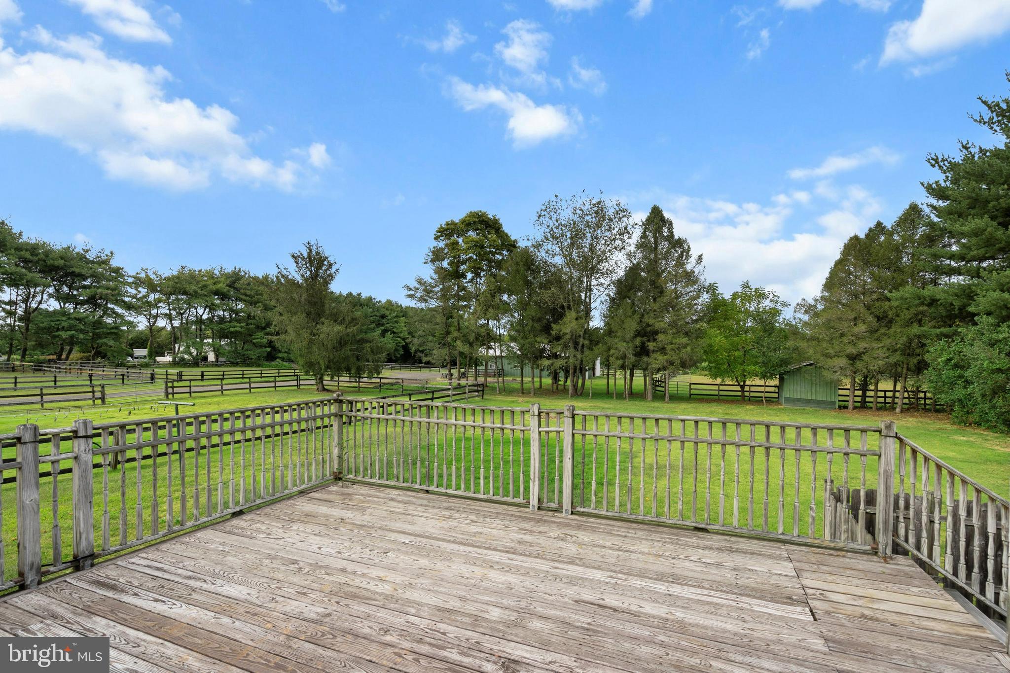 86 Bunting Bridge Road Cookstown, NJ 08511 - Photo 21 of 36 a view of a balcony with a lake
