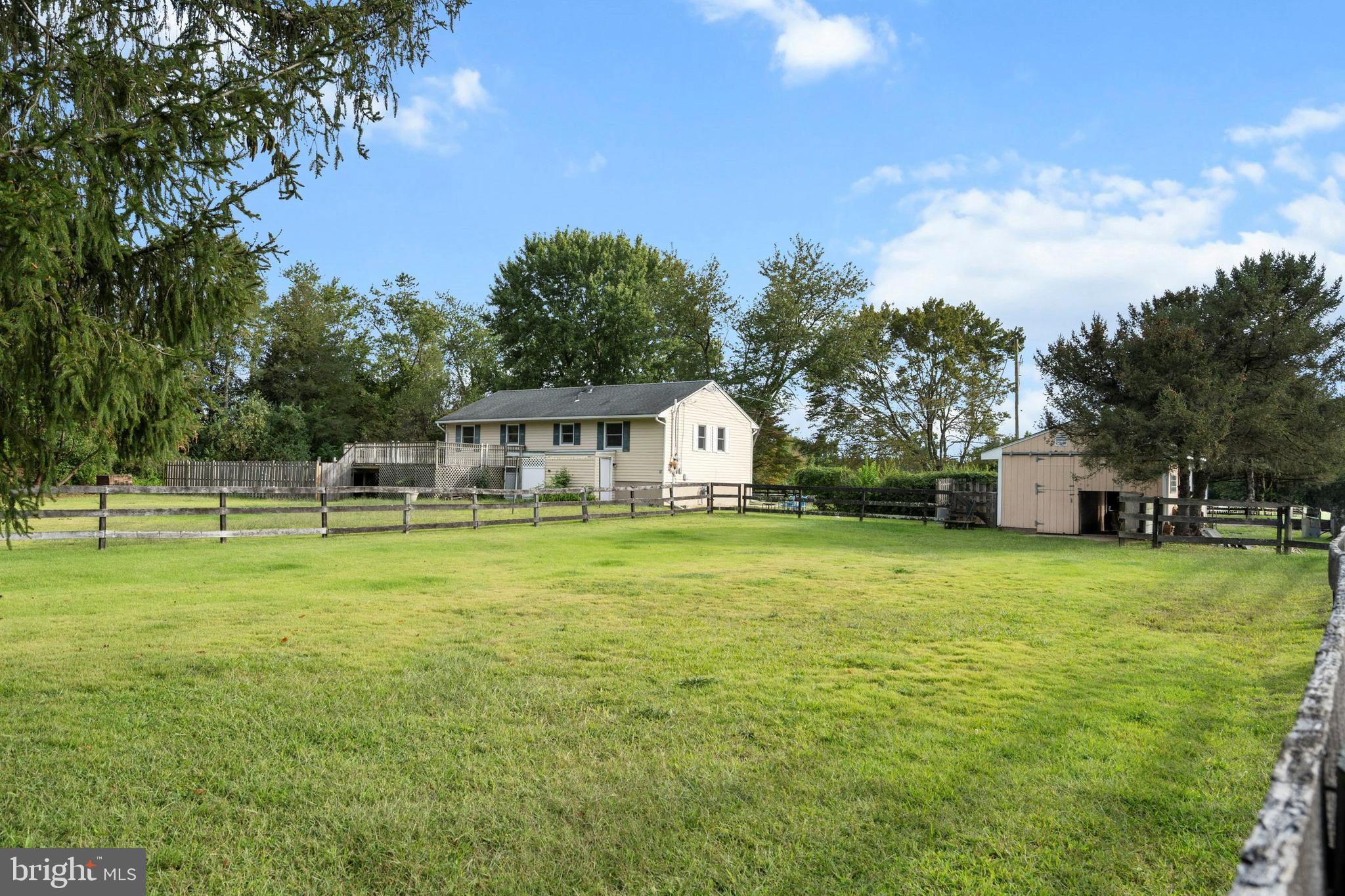 86 Bunting Bridge Road Cookstown, NJ 08511 - Photo 23 of 36 a front view of house with yard and trees