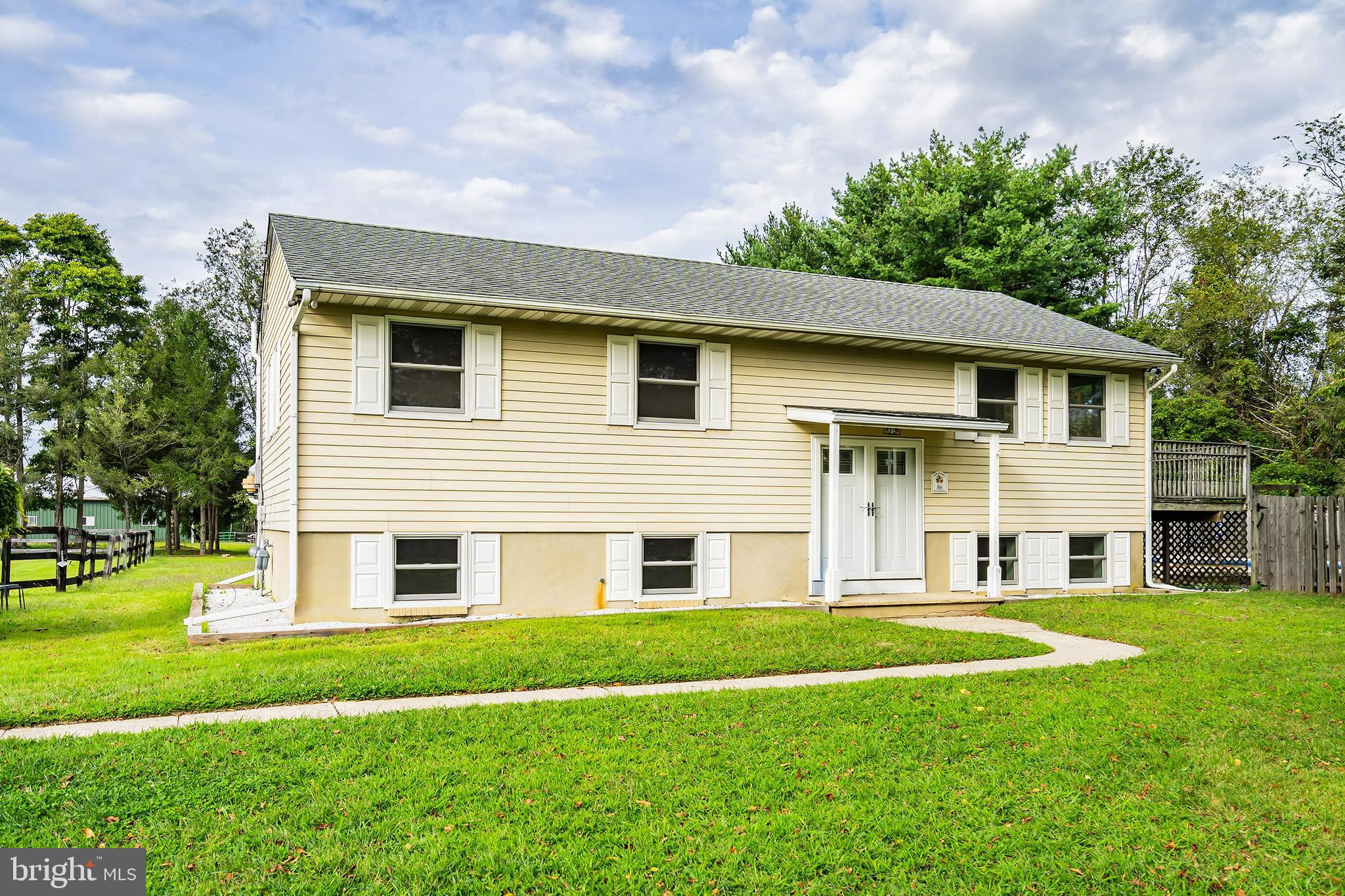 86 Bunting Bridge Road Cookstown, NJ 08511 - Photo 3 of 36 a front view of a house with a yard