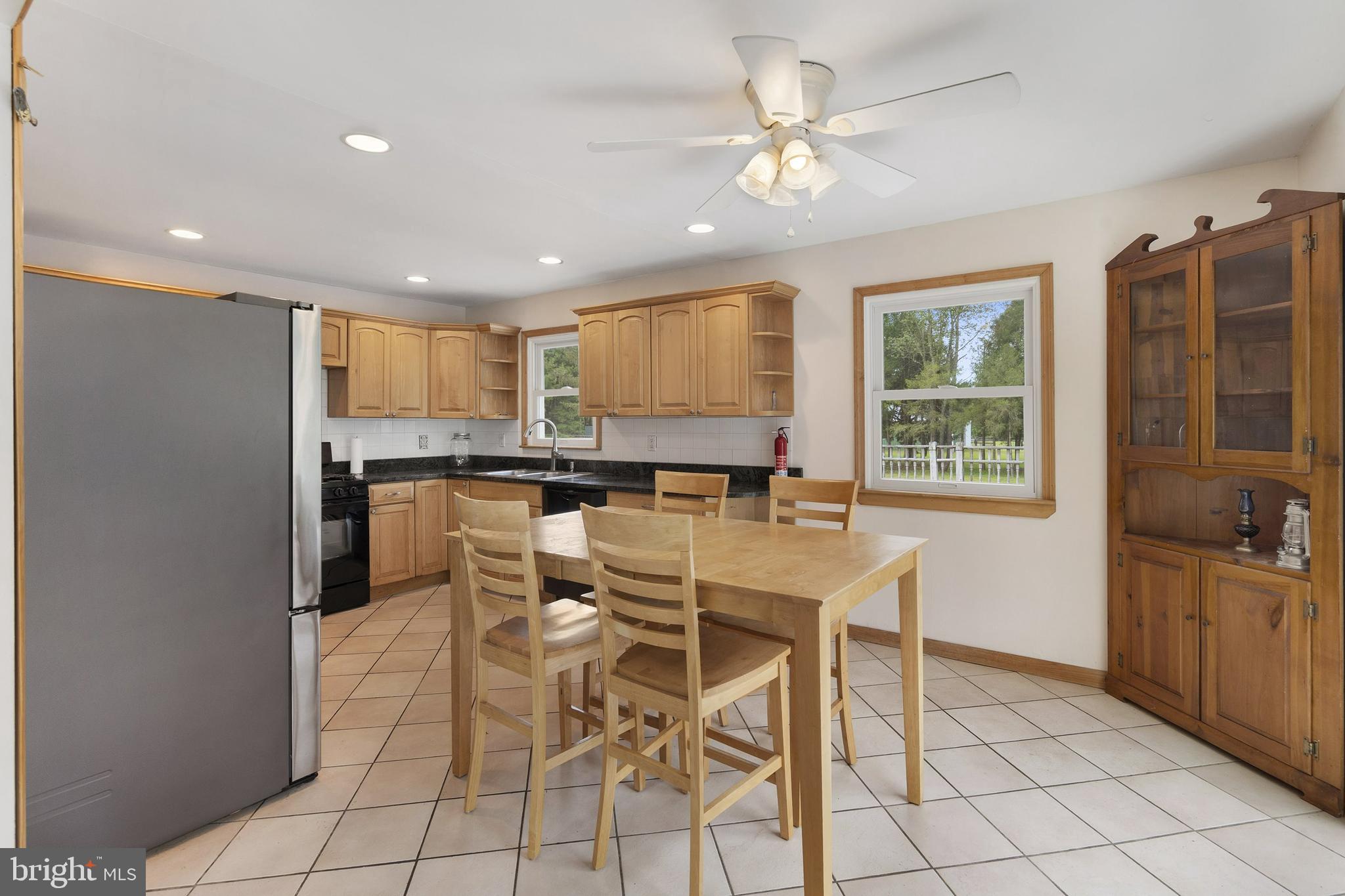 86 Bunting Bridge Road Cookstown, NJ 08511 - Photo 7 of 36 a kitchen with stainless steel appliances kitchen island granite countertop a refrigerator and cabinets