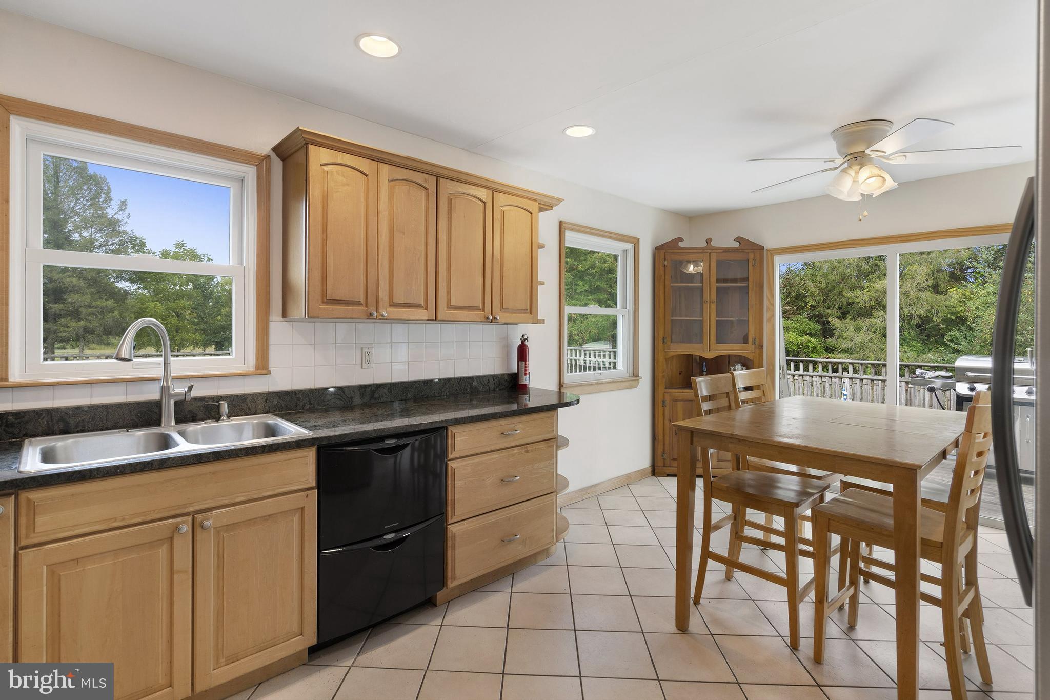 86 Bunting Bridge Road Cookstown, NJ 08511 - Photo 9 of 36 a kitchen with stainless steel appliances granite countertop sink stove and cabinets