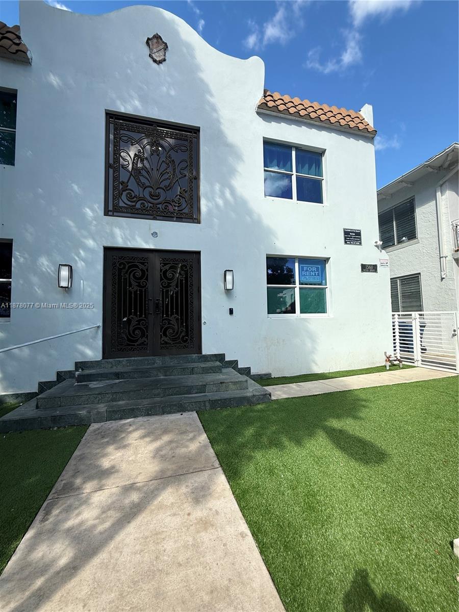1560 Drexel Avenue, Unit 207 Miami Beach, FL 33139 - Photo 11 of 12 a front view of a house with a yard