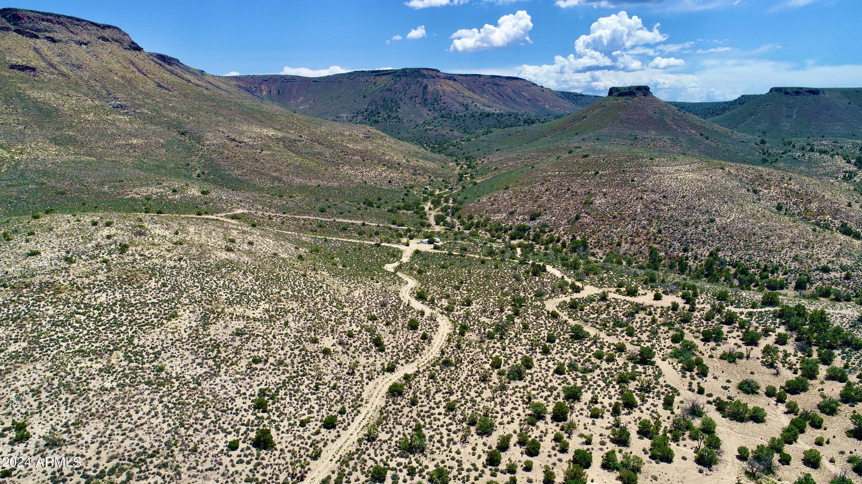 5838 East Diamond Bar Road Meadview, AZ 86444 - Photo 25 of 26 a view of a yard with an outdoor space