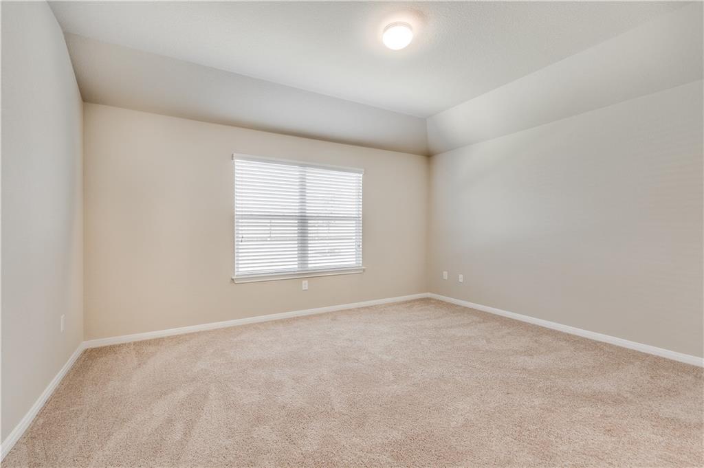 185 Voss Kyle, TX 78640 - Photo 13 of 26 an empty room with windows