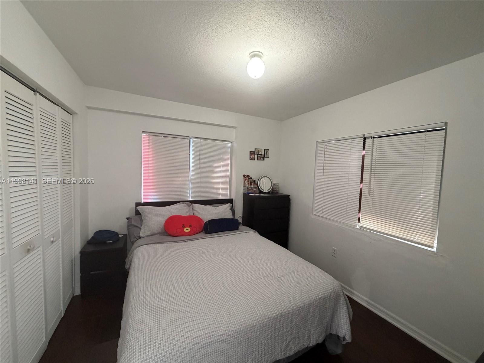 2536 Northwest 24th Street, Unit 3F Miami, FL 33142 - Photo 15 of 17 a bedroom with a bed and a window