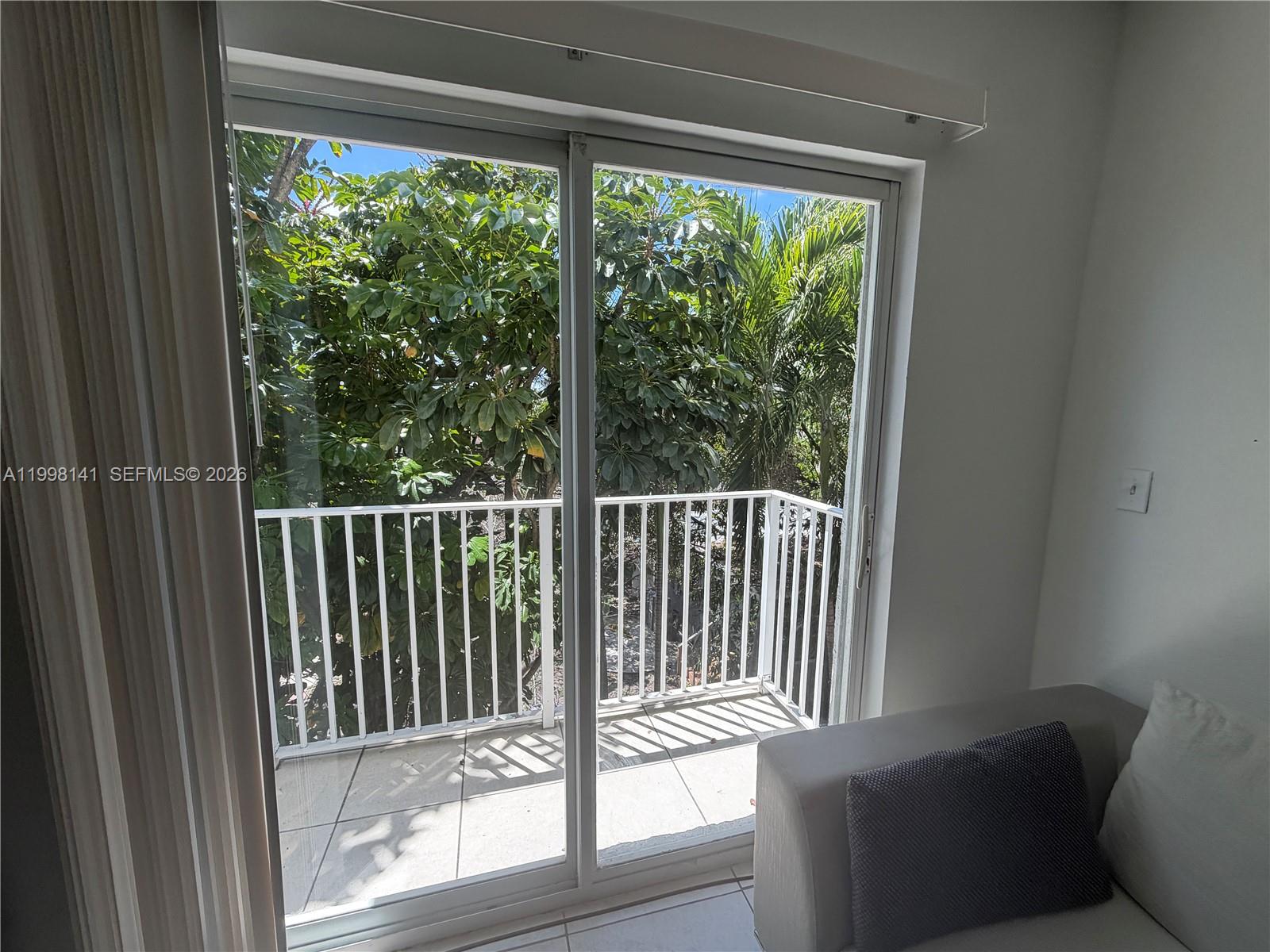 2536 Northwest 24th Street, Unit 3F Miami, FL 33142 - Photo 9 of 17 a view of a balcony with chair