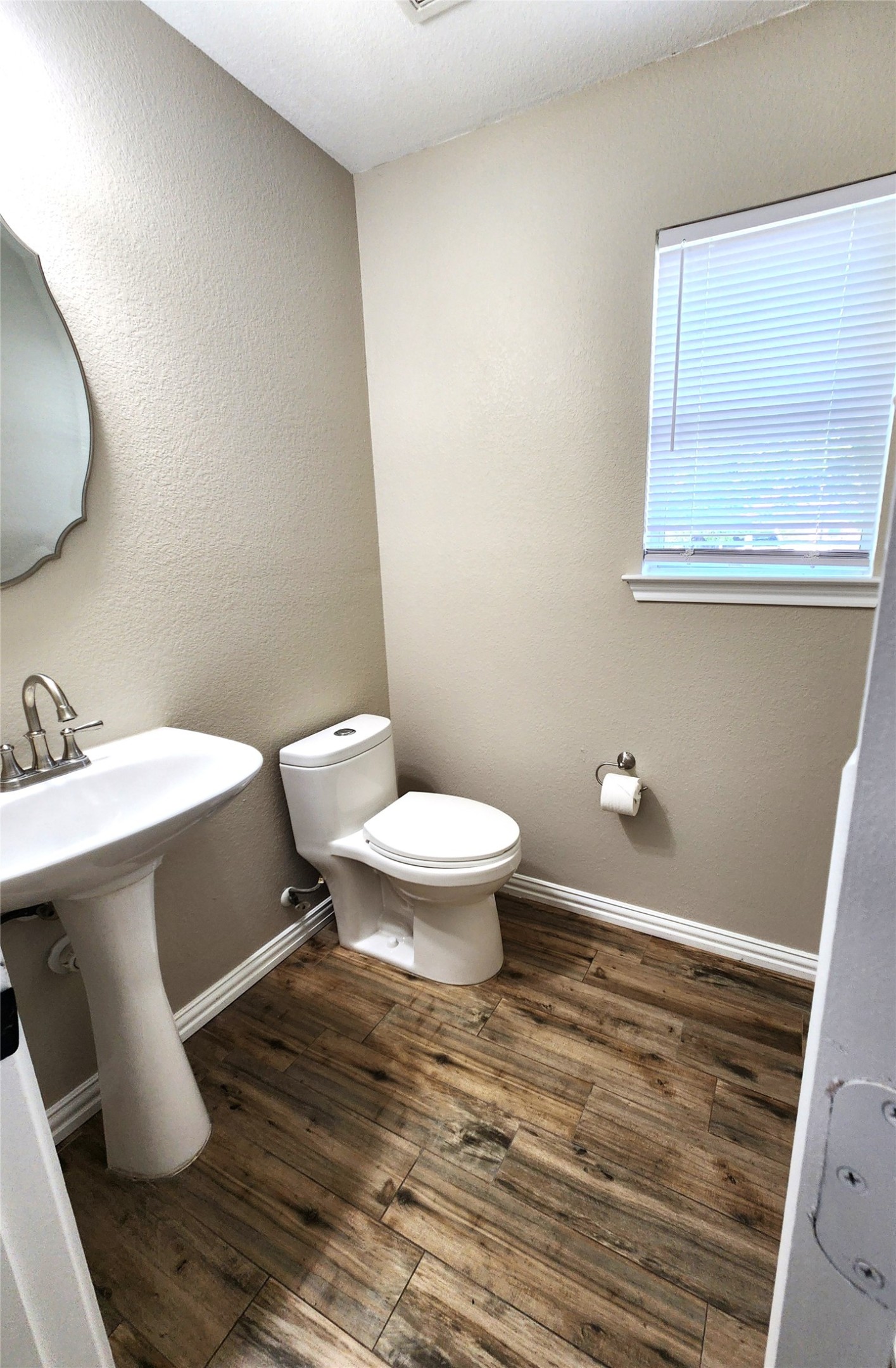 933 Meadow Ridge Loop Georgetown, TX 78626 - Photo 15 of 28 a bathroom with a sink and a toilet