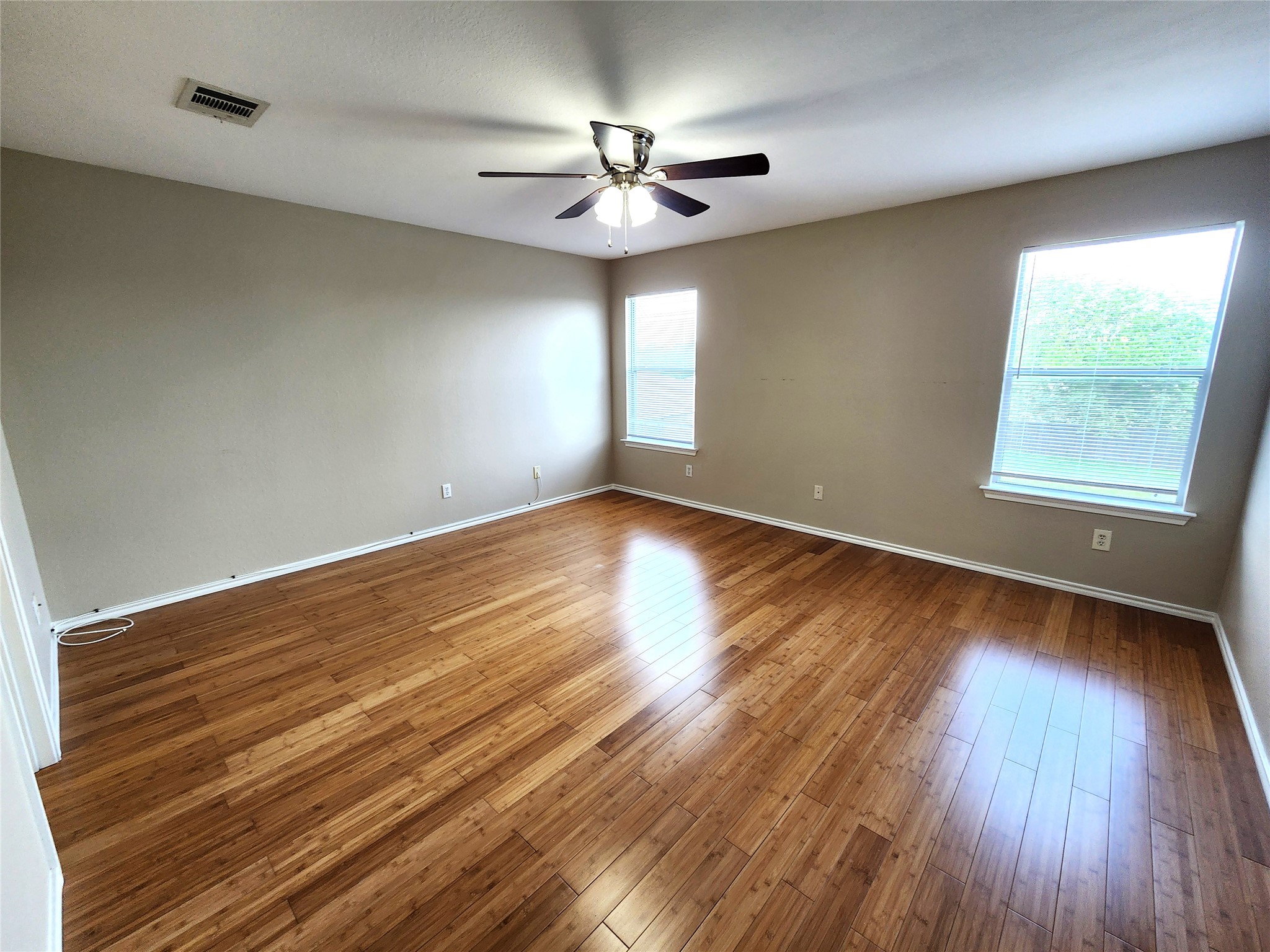 933 Meadow Ridge Loop Georgetown, TX 78626 - Photo 17 of 28 wooden floor in an empty room with a window