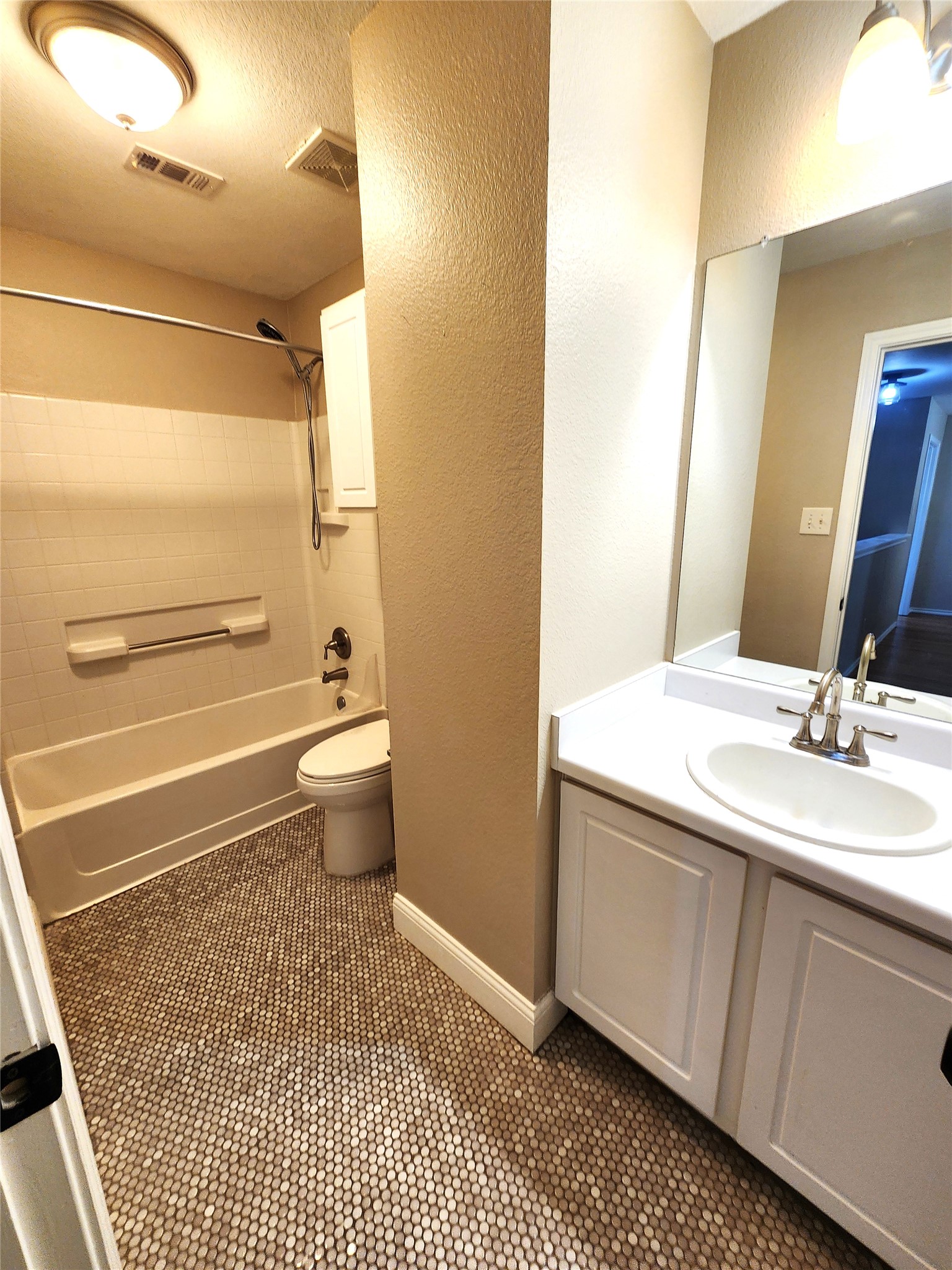 933 Meadow Ridge Loop Georgetown, TX 78626 - Photo 23 of 28 a bathroom with a sink a toilet and shower