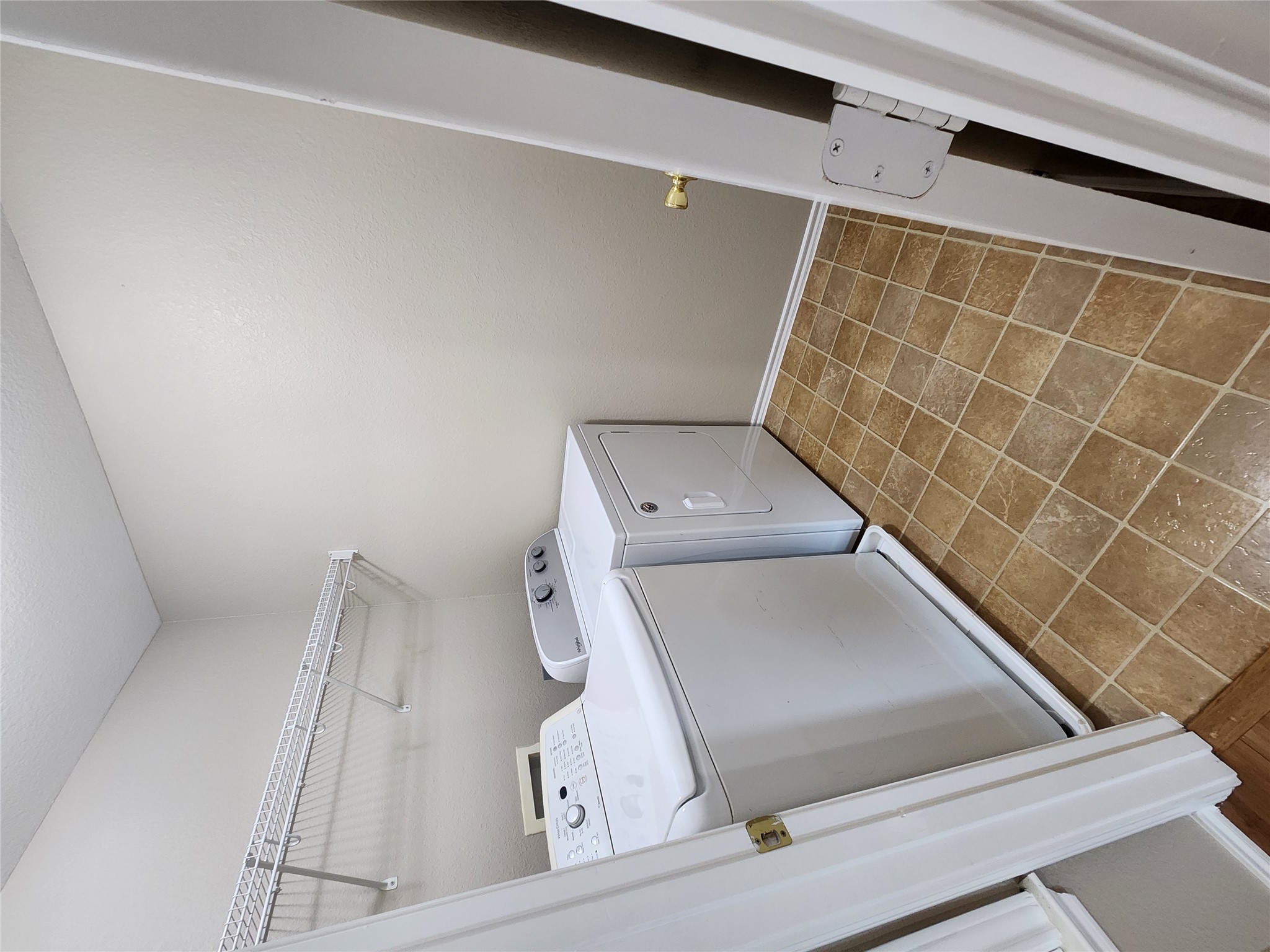 933 Meadow Ridge Loop Georgetown, TX 78626 - Photo 25 of 28 a utility room with dryer and washer