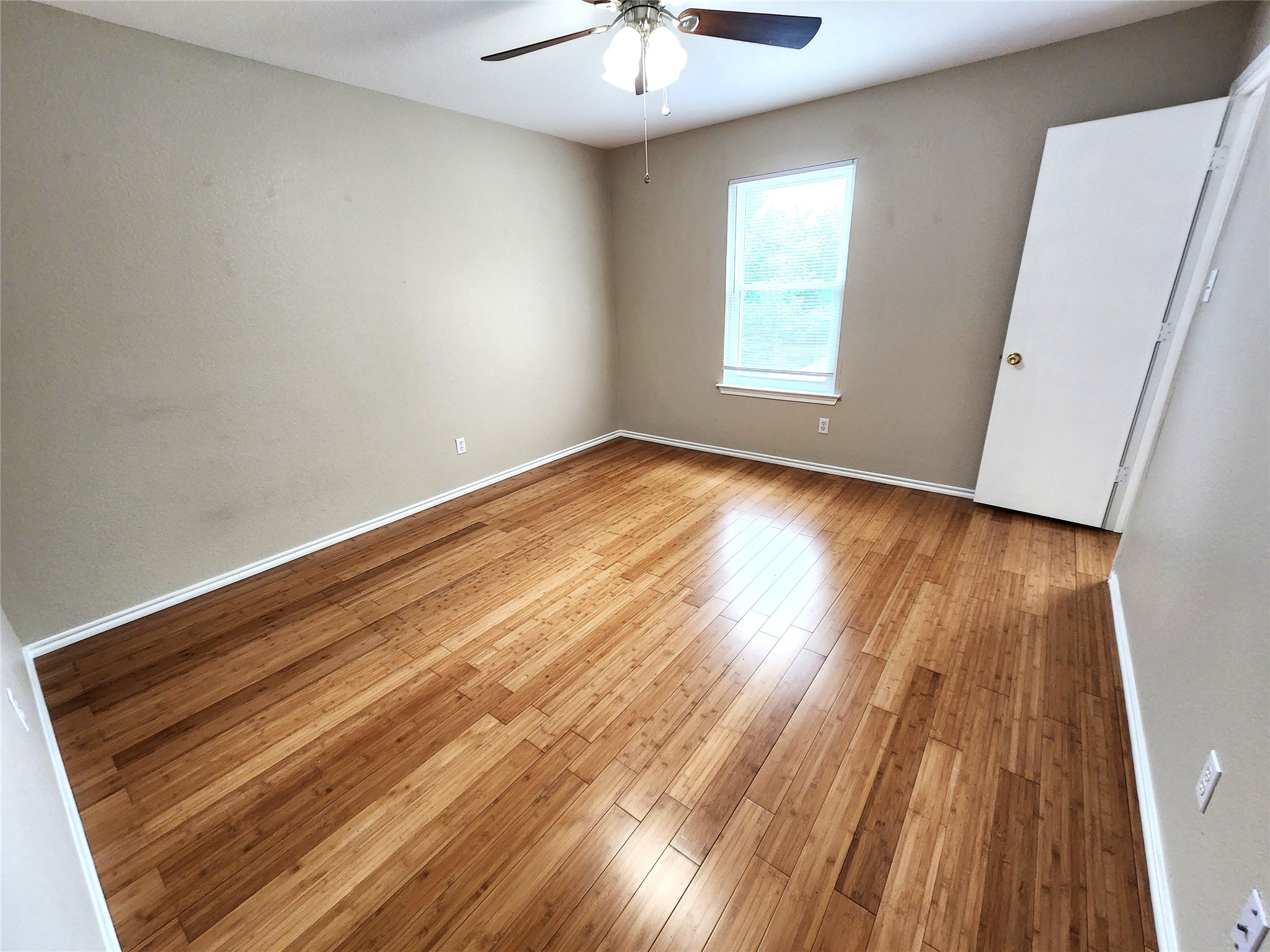 933 Meadow Ridge Loop Georgetown, TX 78626 - Photo 26 of 28 wooden floor in an empty room with a window