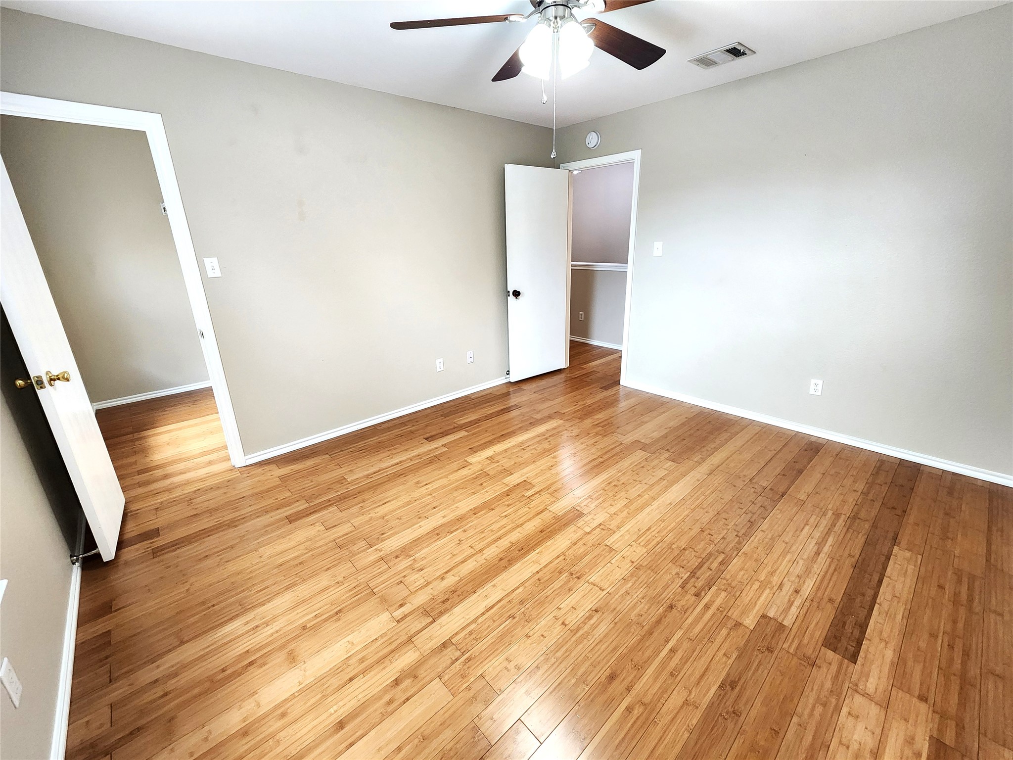 933 Meadow Ridge Loop Georgetown, TX 78626 - Photo 27 of 28 an empty room with wooden floor and entryway