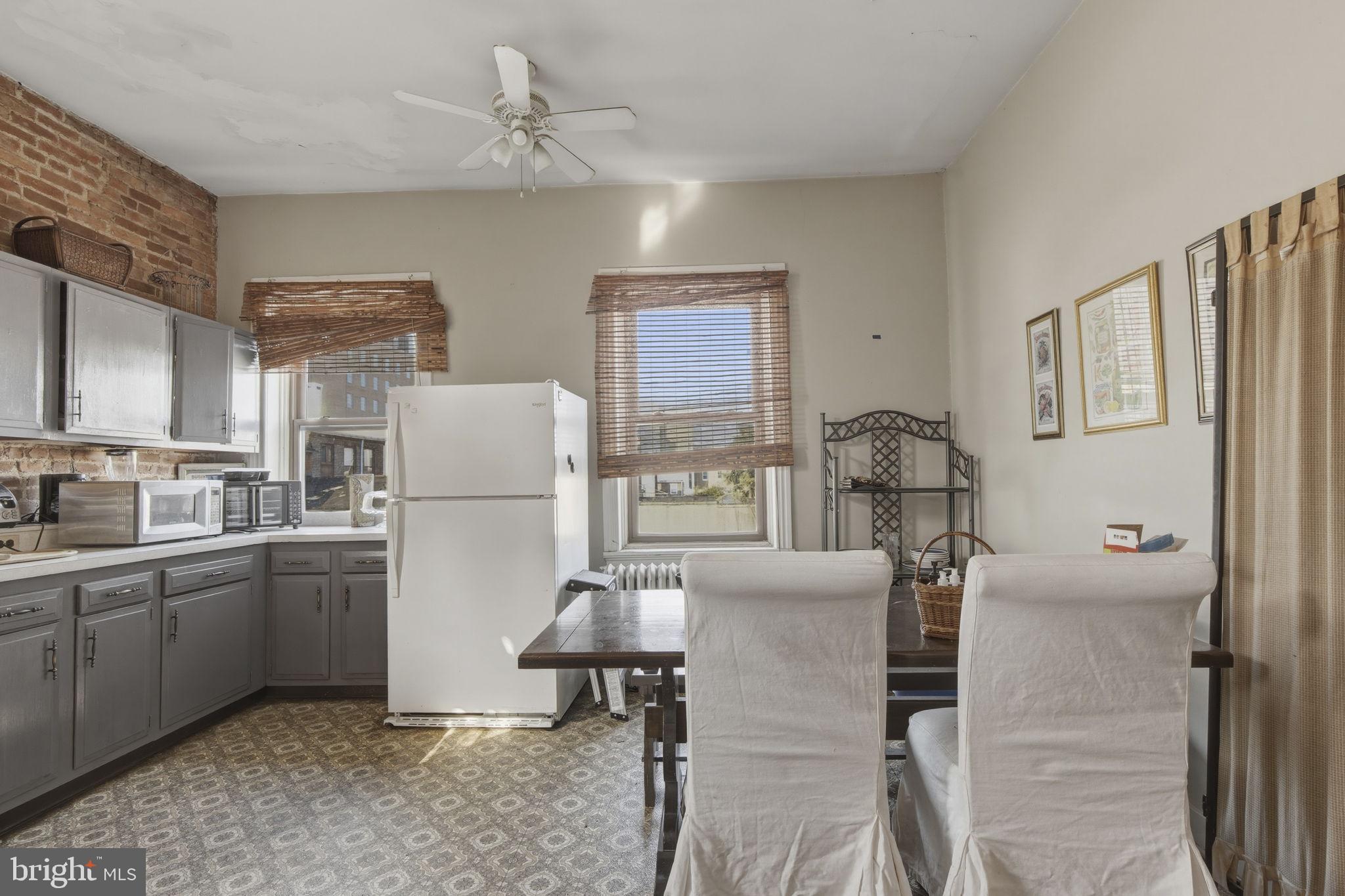 222 West Madison Street Baltimore, MD 21201 - Photo 12 of 40 a kitchen with sink cabinets and refrigerator
