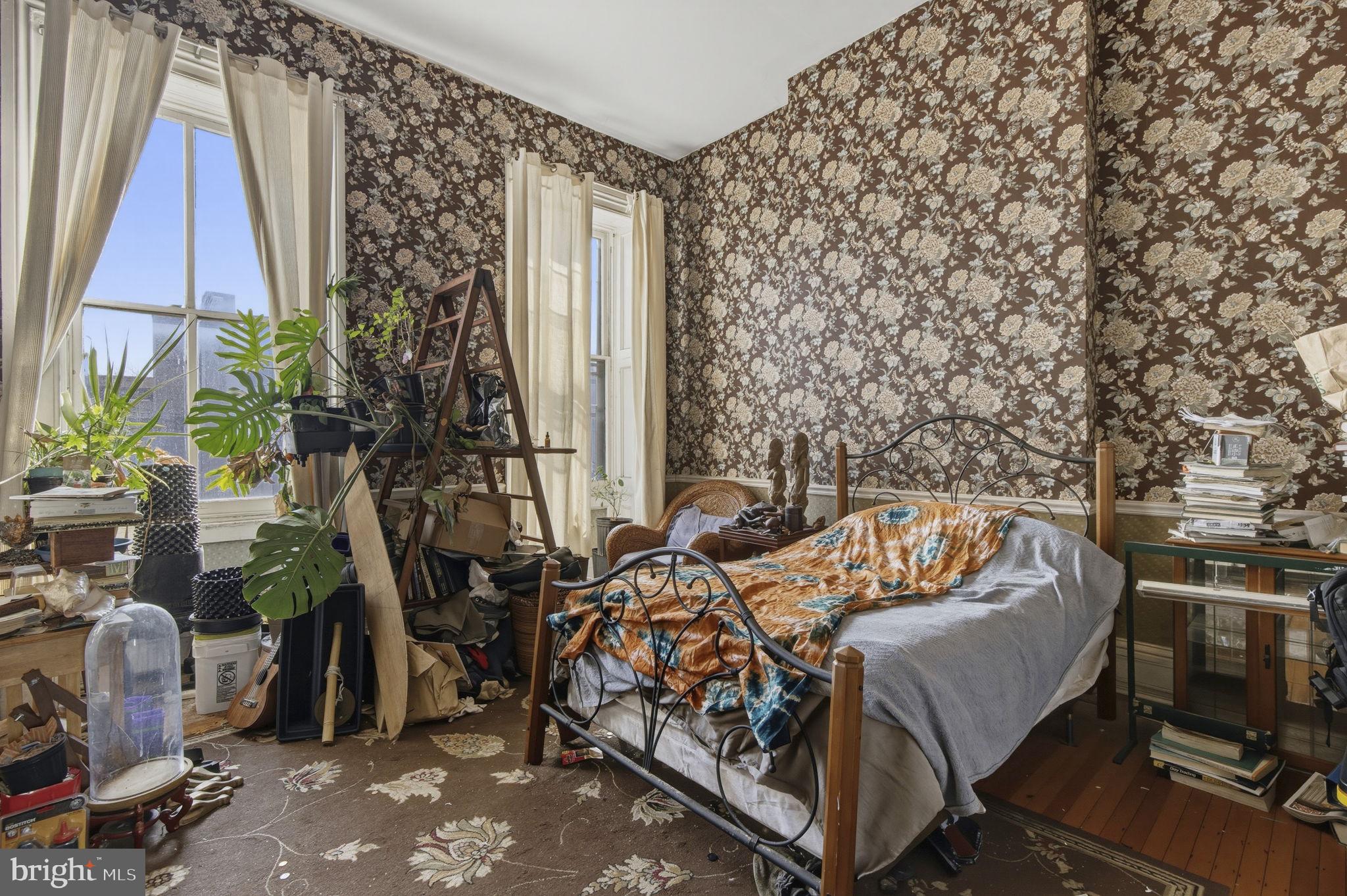 222 West Madison Street Baltimore, MD 21201 - Photo 15 of 40 a bed sitting in a bedroom next to a window