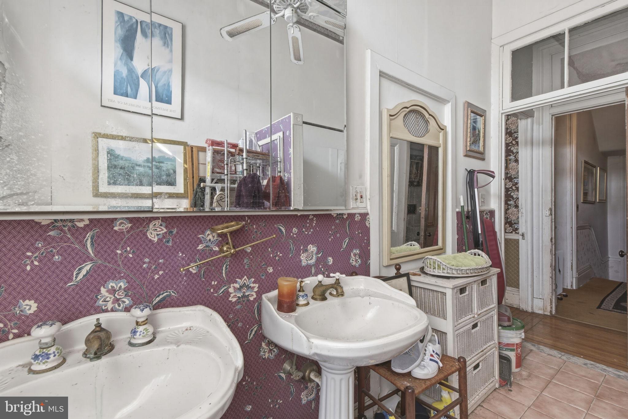 222 West Madison Street Baltimore, MD 21201 - Photo 18 of 40 a bathroom with a sink and a mirror