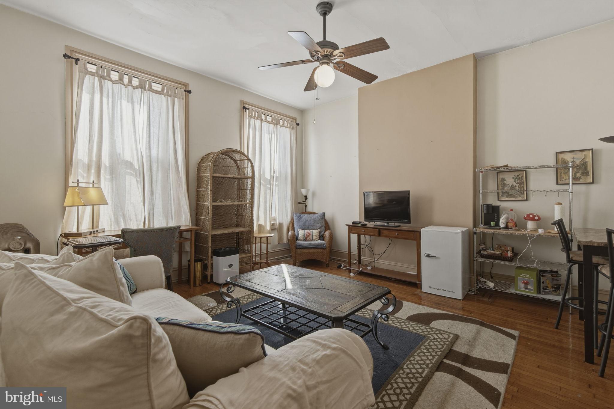 222 West Madison Street Baltimore, MD 21201 - Photo 27 of 40 a living room with furniture and a flat screen tv