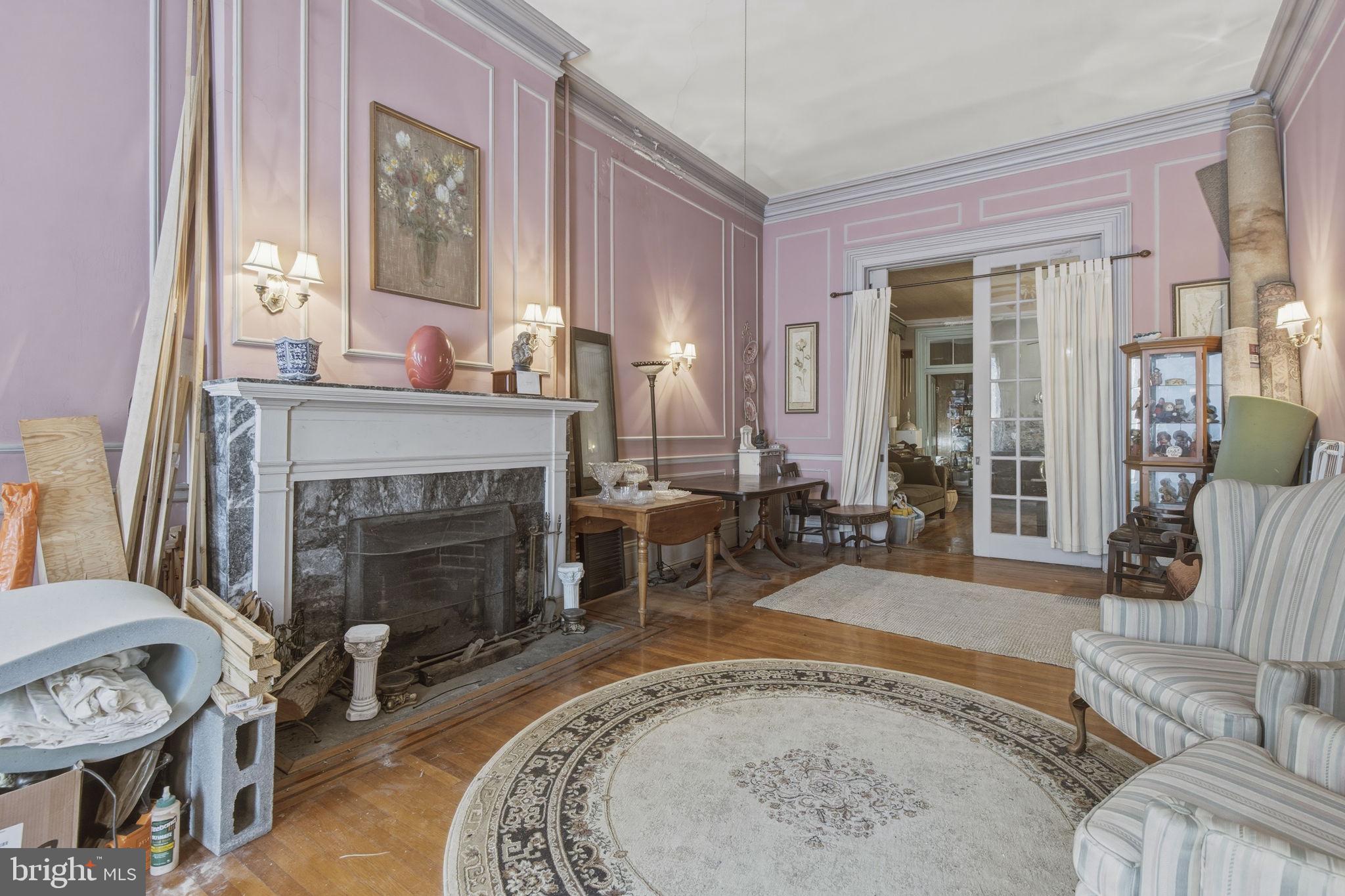 222 West Madison Street Baltimore, MD 21201 - Photo 3 of 40 a living room with furniture and a fireplace