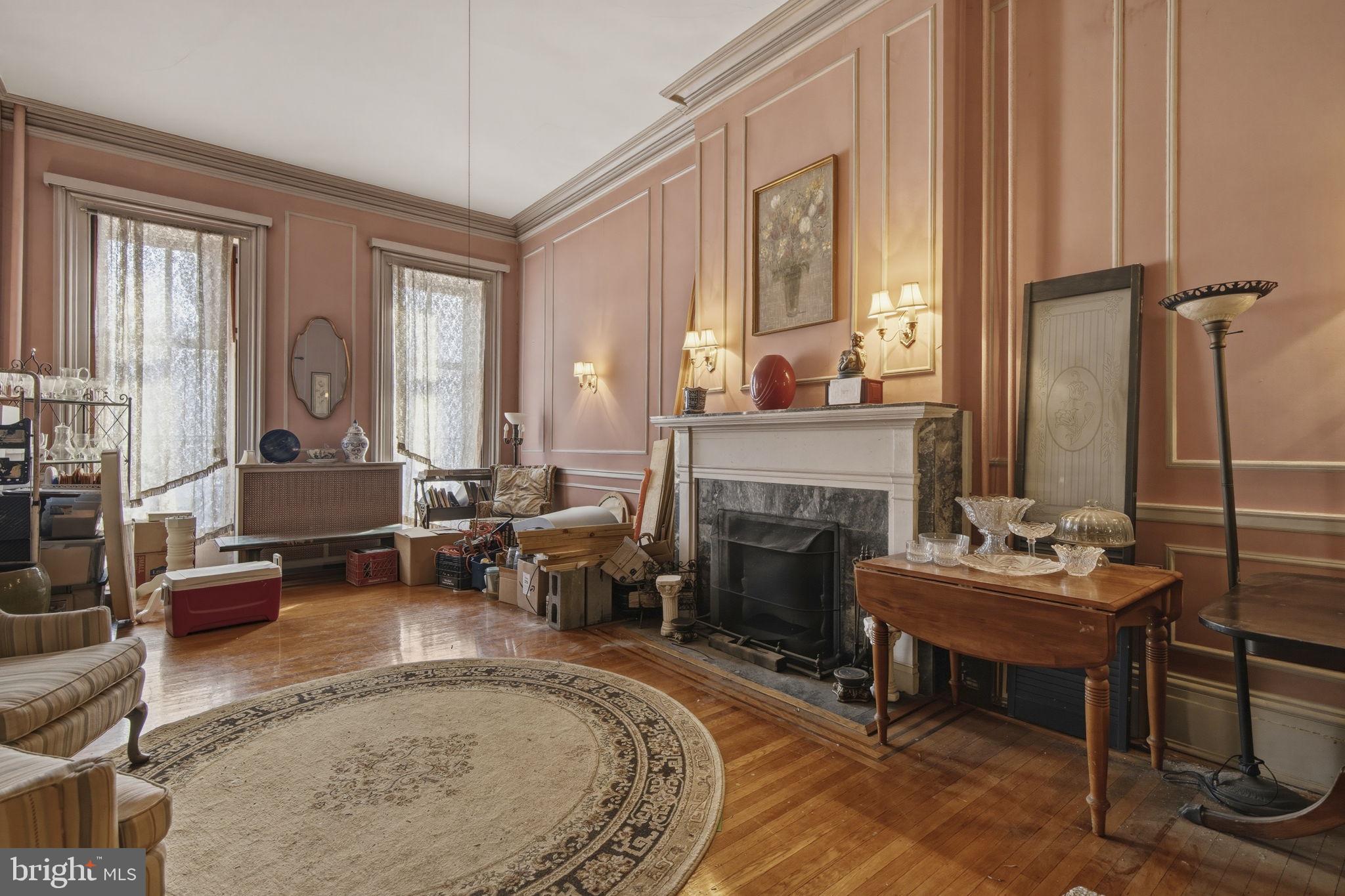 222 West Madison Street Baltimore, MD 21201 - Photo 5 of 40 a living room with furniture and a fireplace