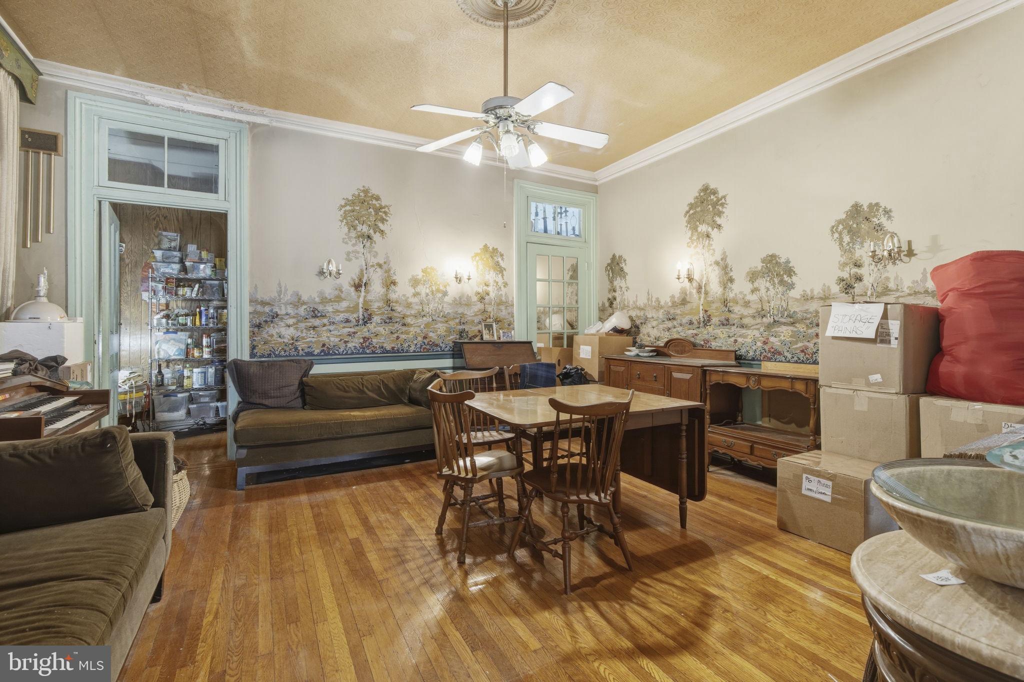 222 West Madison Street Baltimore, MD 21201 - Photo 8 of 40 a living room with furniture and a chandelier