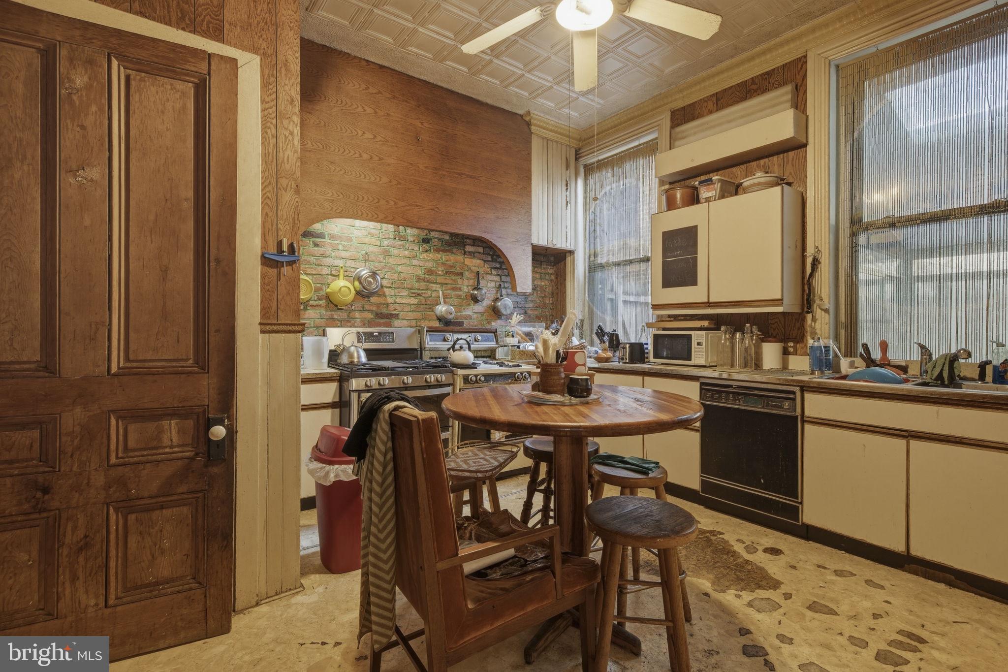 222 West Madison Street Baltimore, MD 21201 - Photo 9 of 40 a kitchen with stainless steel appliances granite countertop a sink and cabinets
