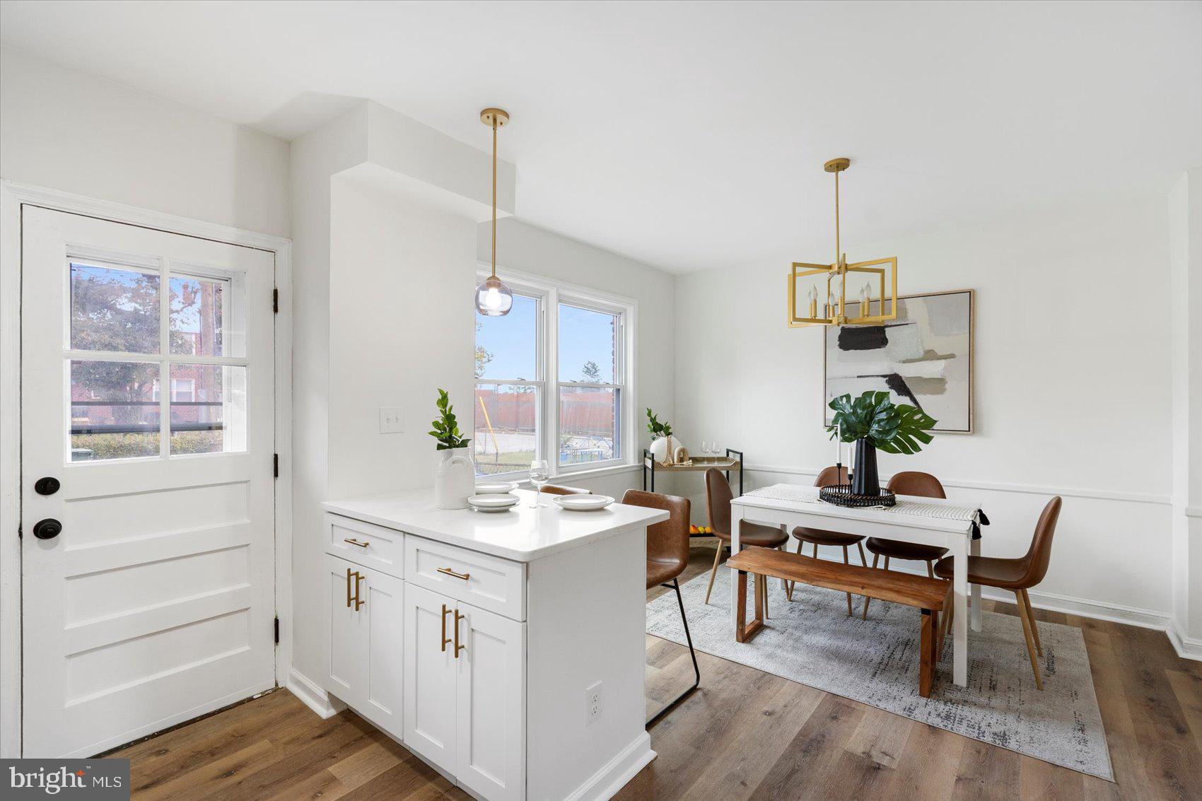 1656 Ramblewood Road Baltimore, MD 21239 - Photo 17 of 40 a view of a kitchen with a table and chairs