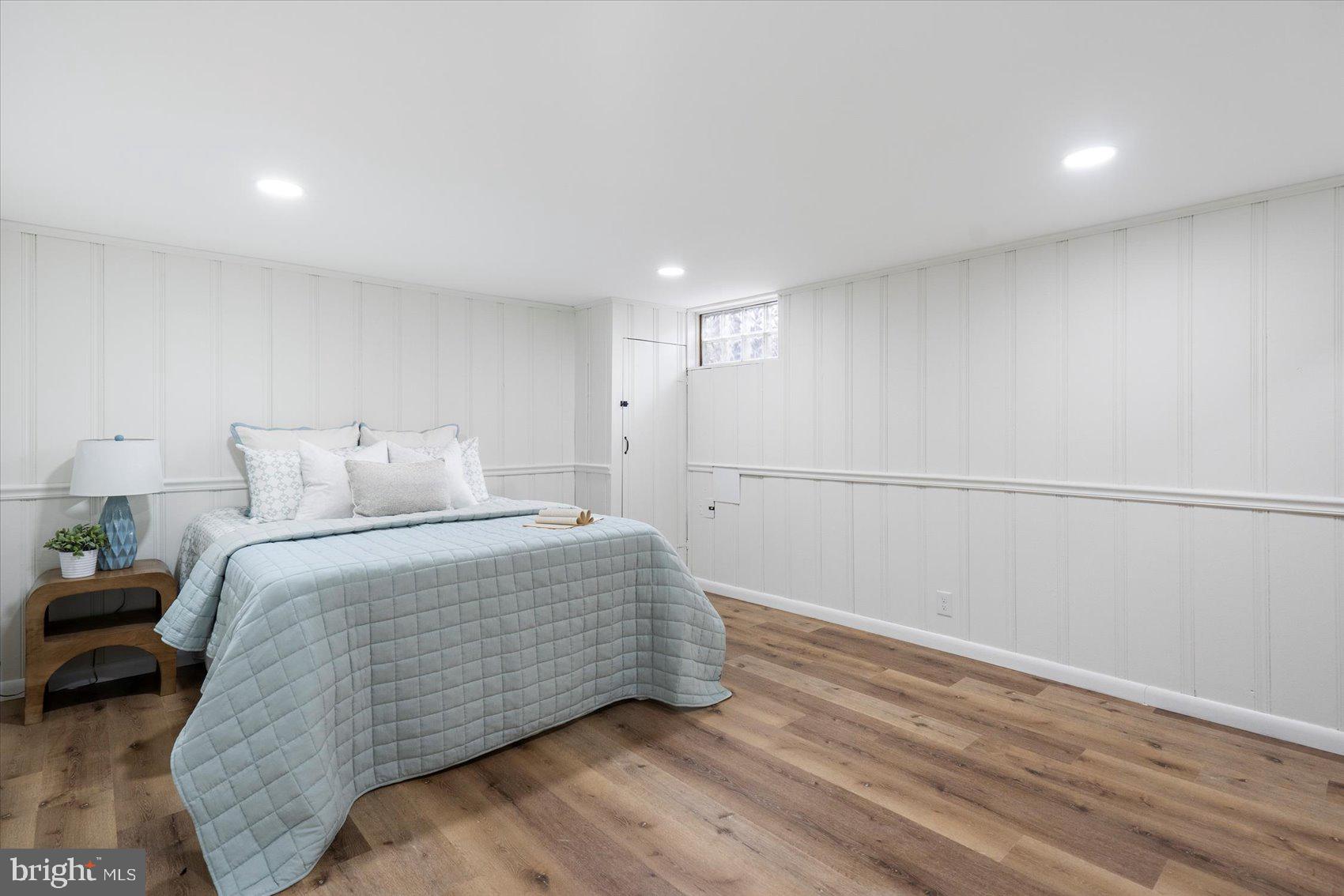 1656 Ramblewood Road Baltimore, MD 21239 - Photo 20 of 40 a bedroom with a bed and a painting on the wall