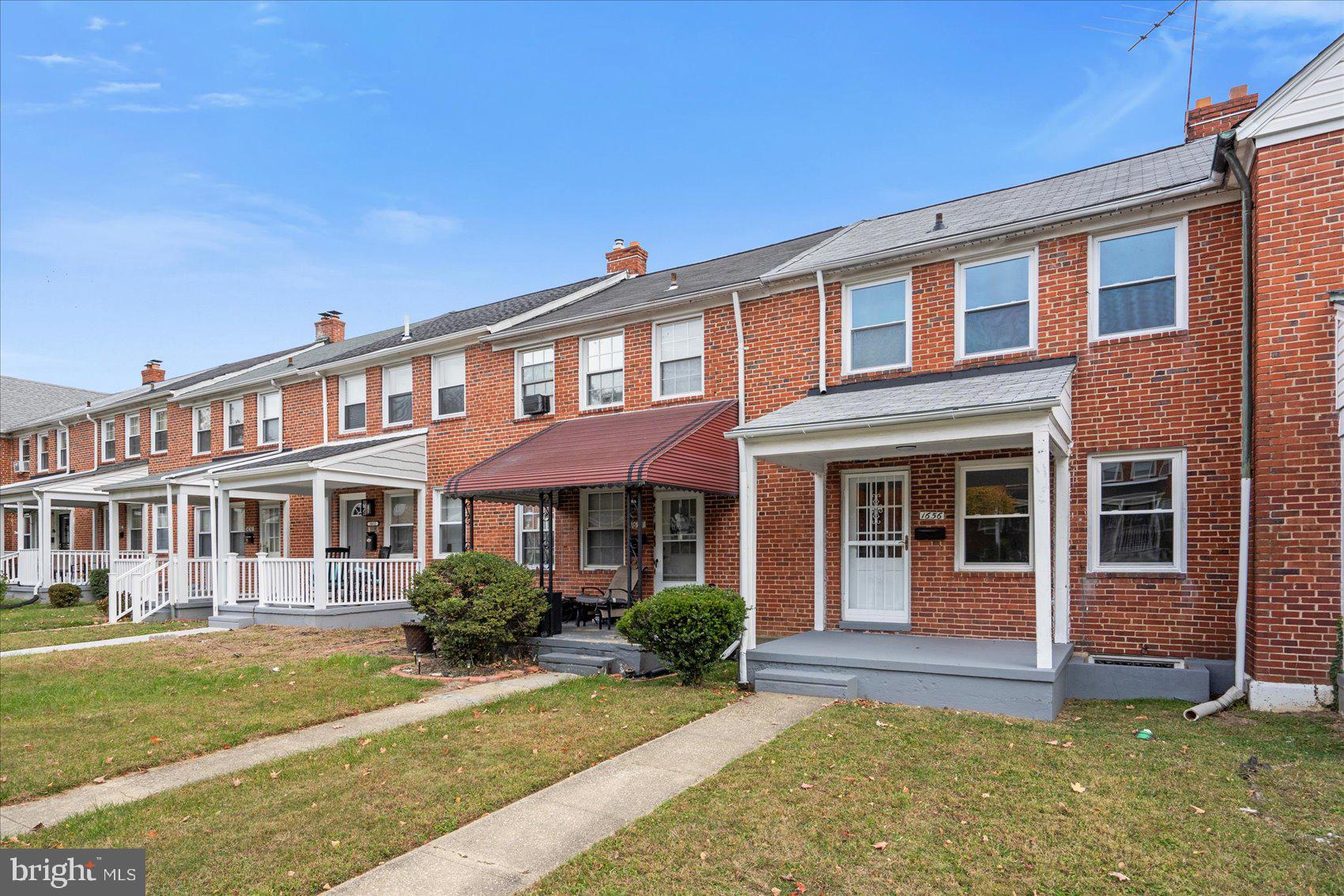1656 Ramblewood Road Baltimore, MD 21239 - Photo 2 of 40 a front view of a house with garden