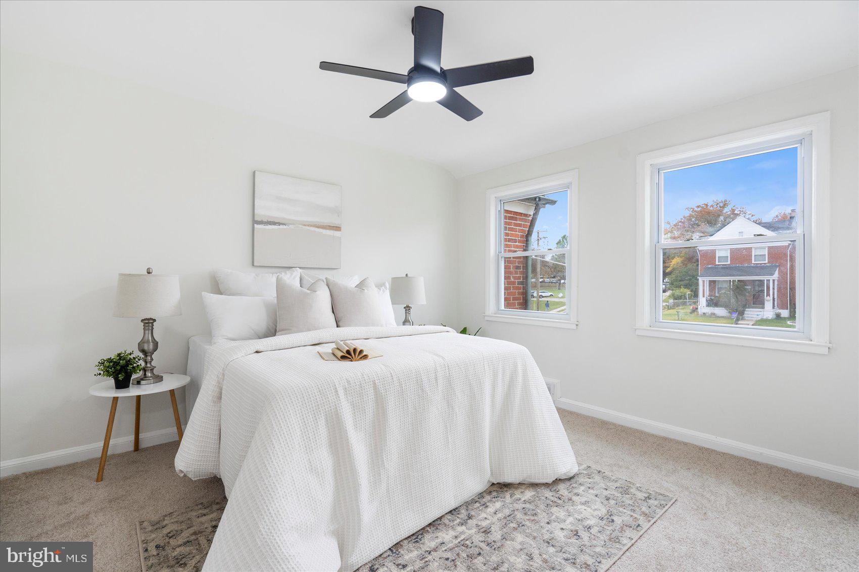 1656 Ramblewood Road Baltimore, MD 21239 - Photo 26 of 40 a bed room with a bed and a painting on the wall