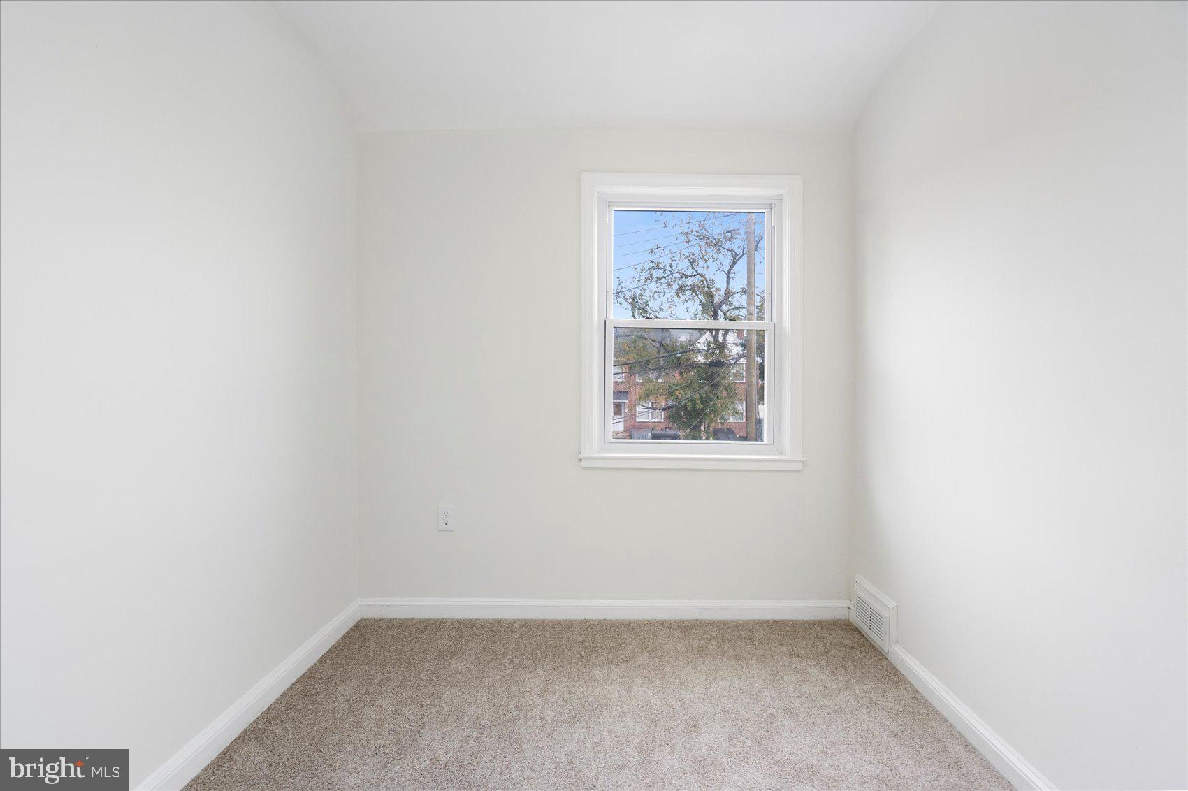 1656 Ramblewood Road Baltimore, MD 21239 - Photo 29 of 40 an empty room with a window