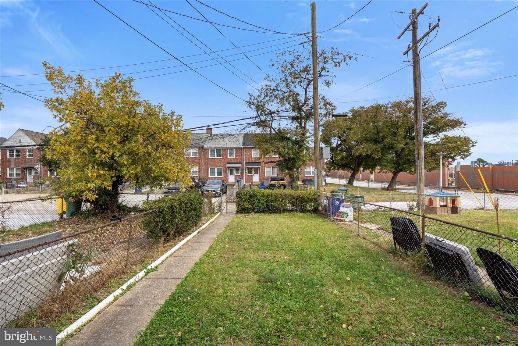 1656 Ramblewood Road Baltimore, MD 21239 - Photo 37 of 40 a view of a house with a yard