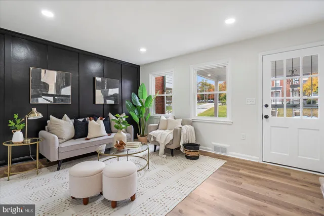 a living room with furniture and windows