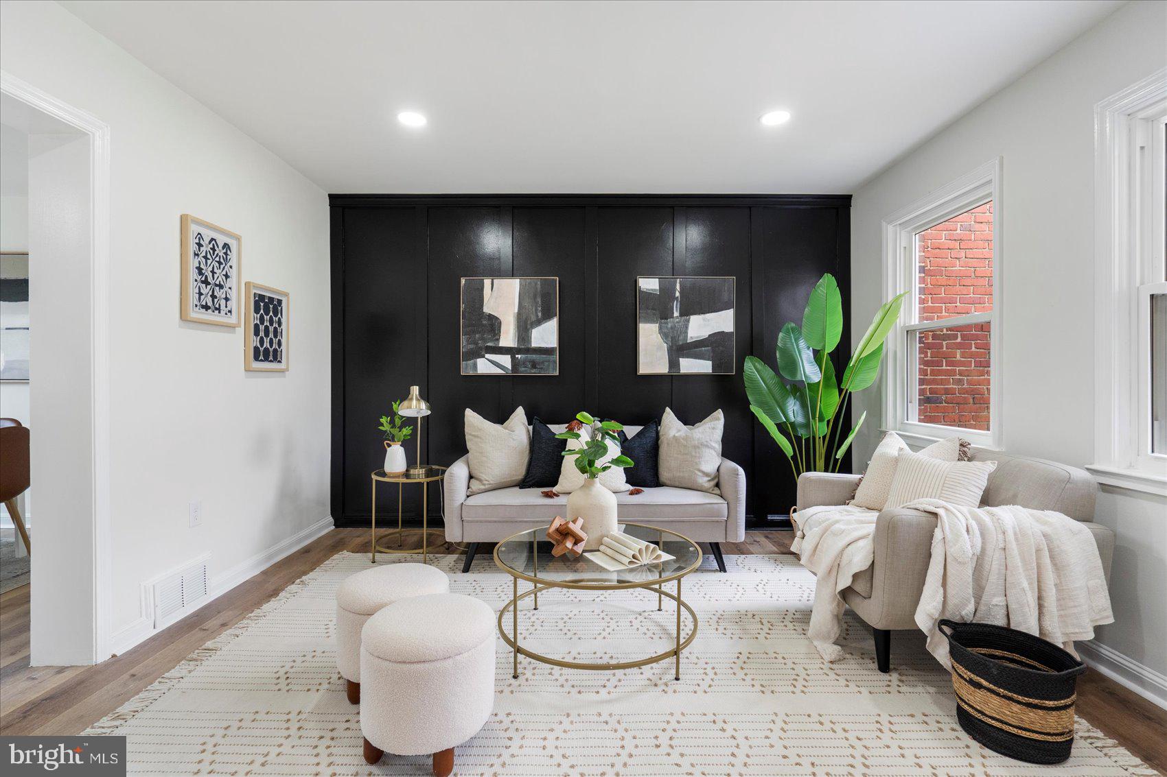 1656 Ramblewood Road Baltimore, MD 21239 - Photo 5 of 40 a living room with furniture and a potted plant